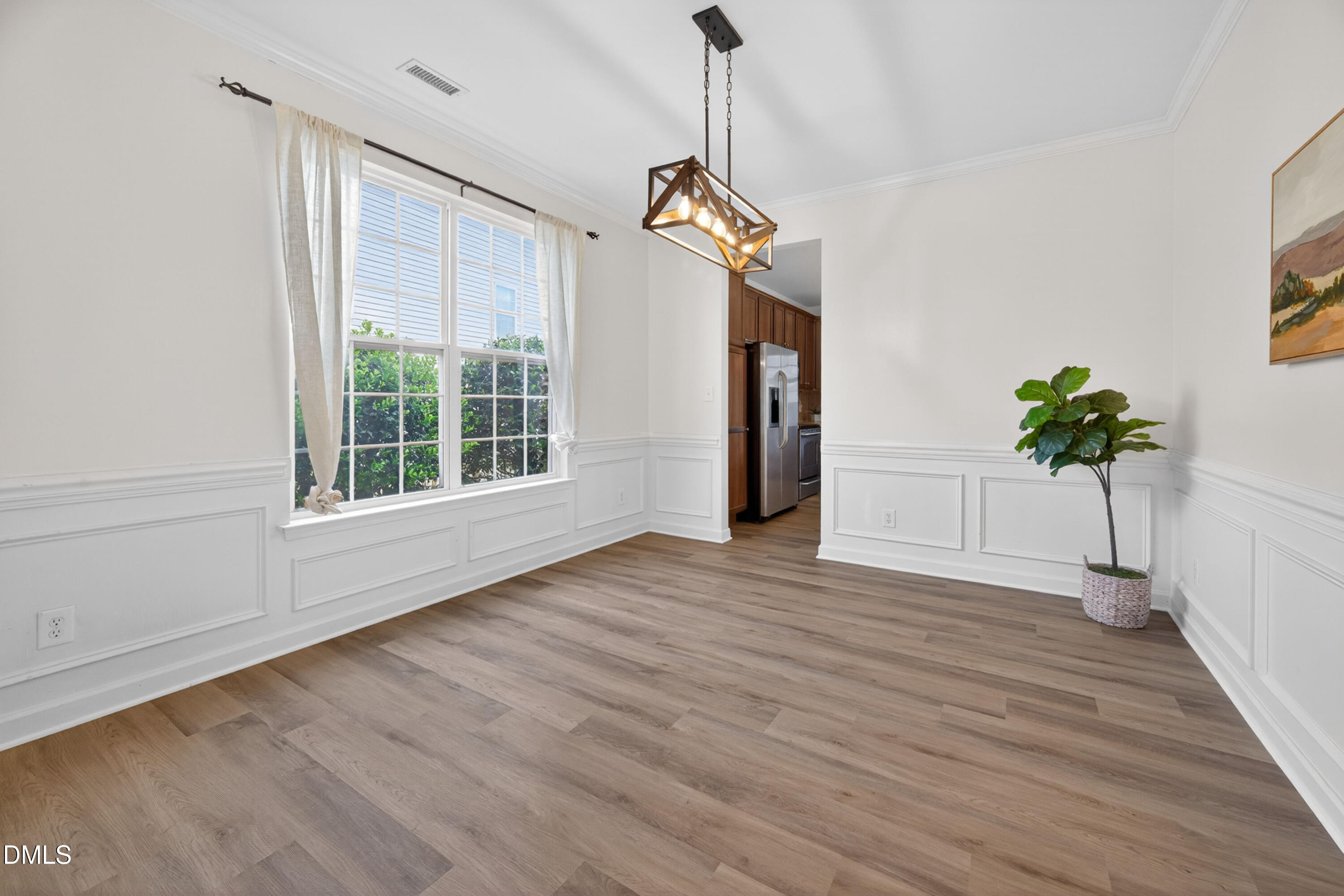 5304 Stone Station Drive Raleigh, NC 27616 - Photo 7 of 34 a view of an entryway with wooden floor and a window