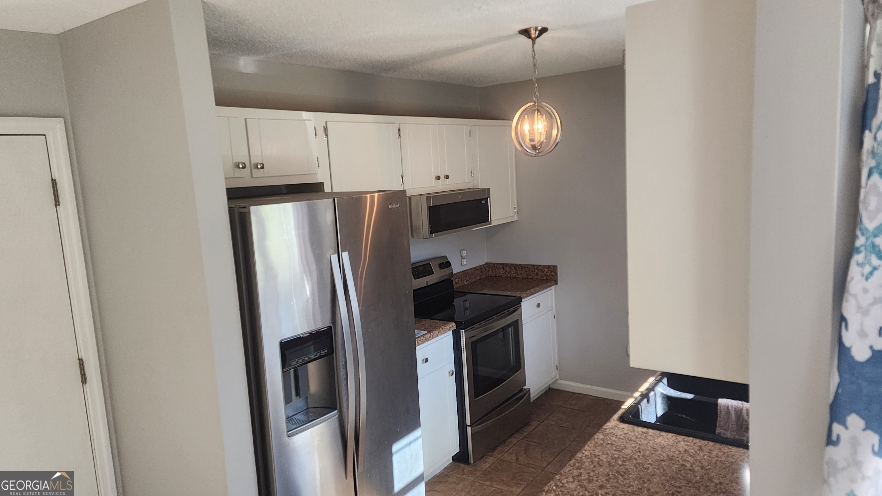 113 Almond Circle Kingsland, GA 31548 - Photo 19 of 34 a kitchen with stainless steel appliances granite countertop a refrigerator a stove and a sink