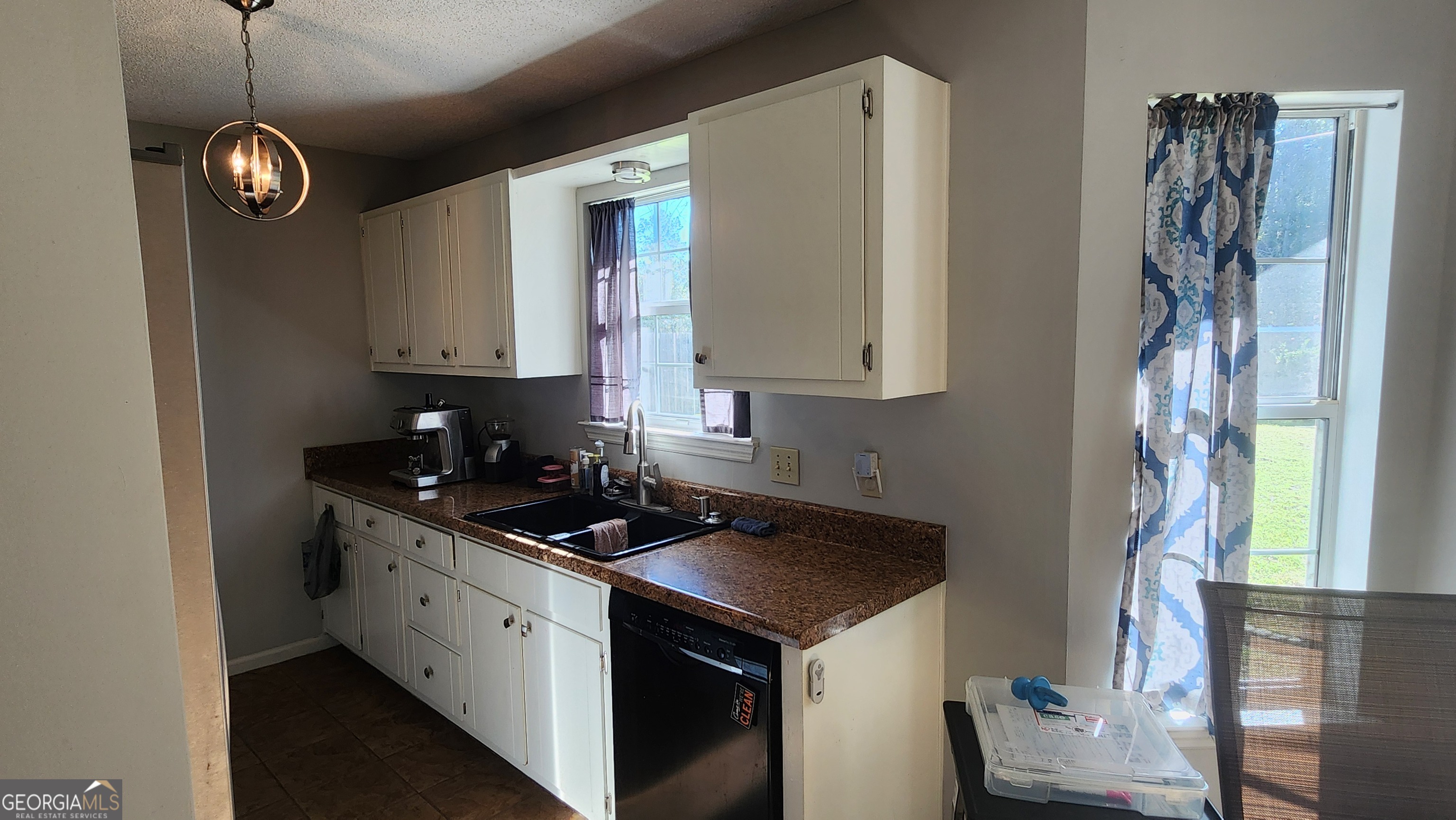 113 Almond Circle Kingsland, GA 31548 - Photo 20 of 34 a kitchen with stainless steel appliances granite countertop a sink a stove and a refrigerator