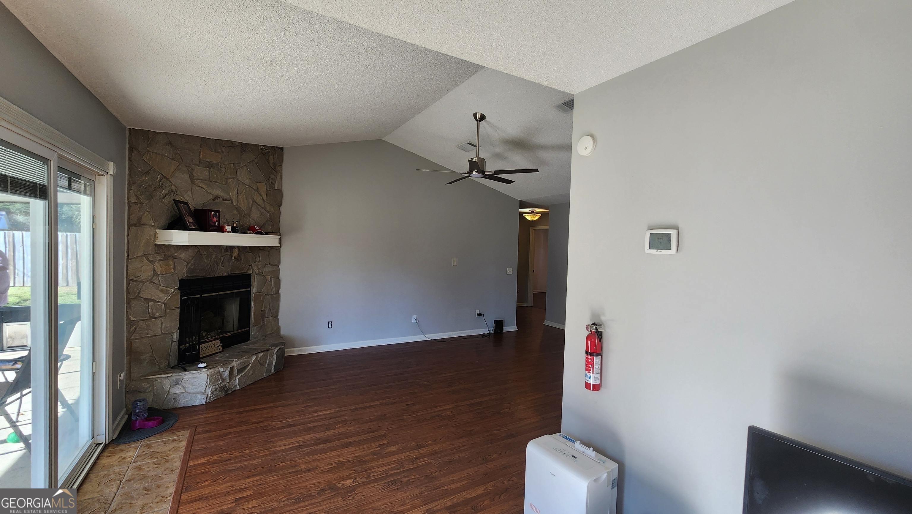 113 Almond Circle Kingsland, GA 31548 - Photo 22 of 34 a room with furniture and a fireplace