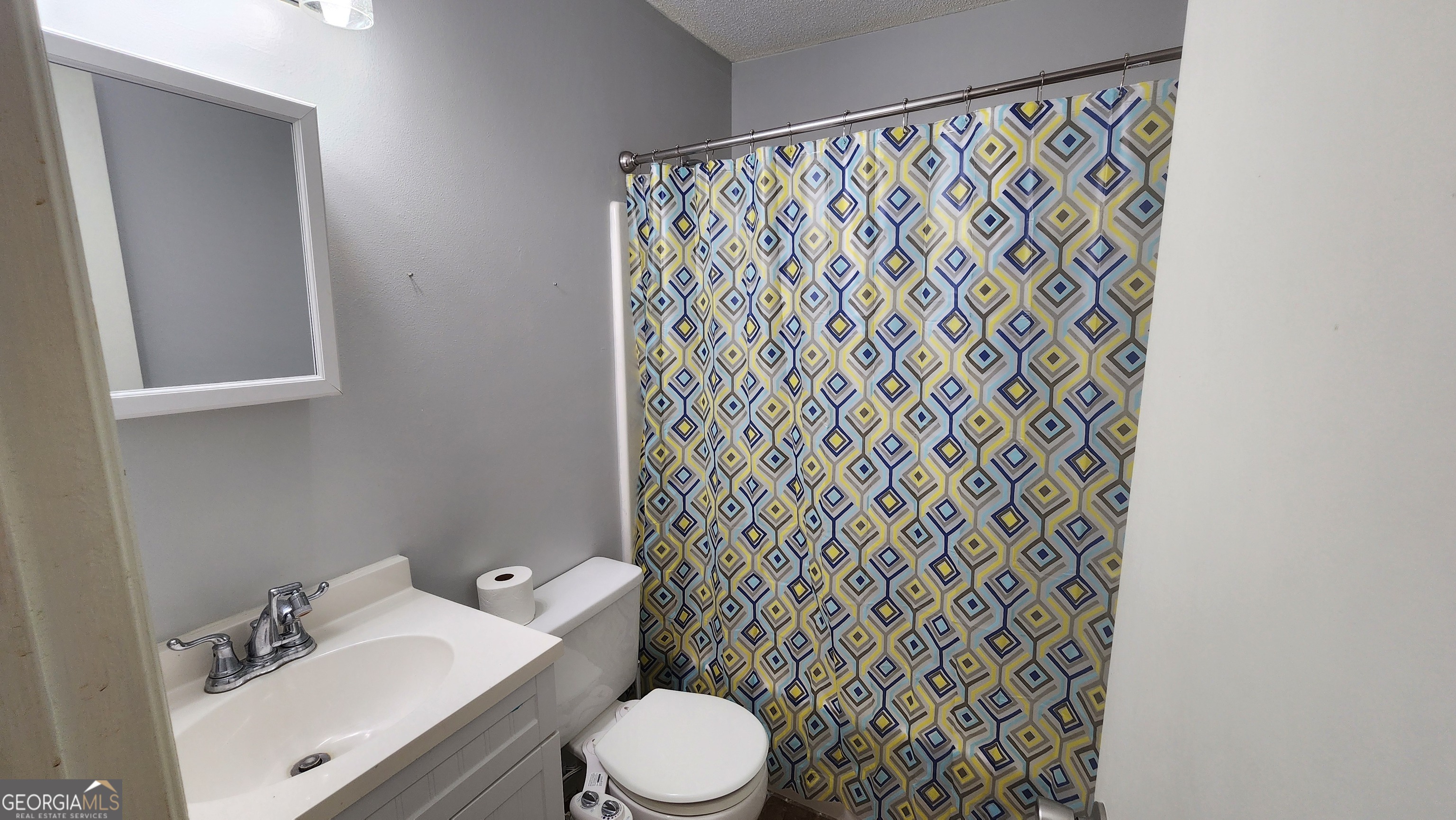 113 Almond Circle Kingsland, GA 31548 - Photo 28 of 34 a white toilet sitting next to a bathroom sink