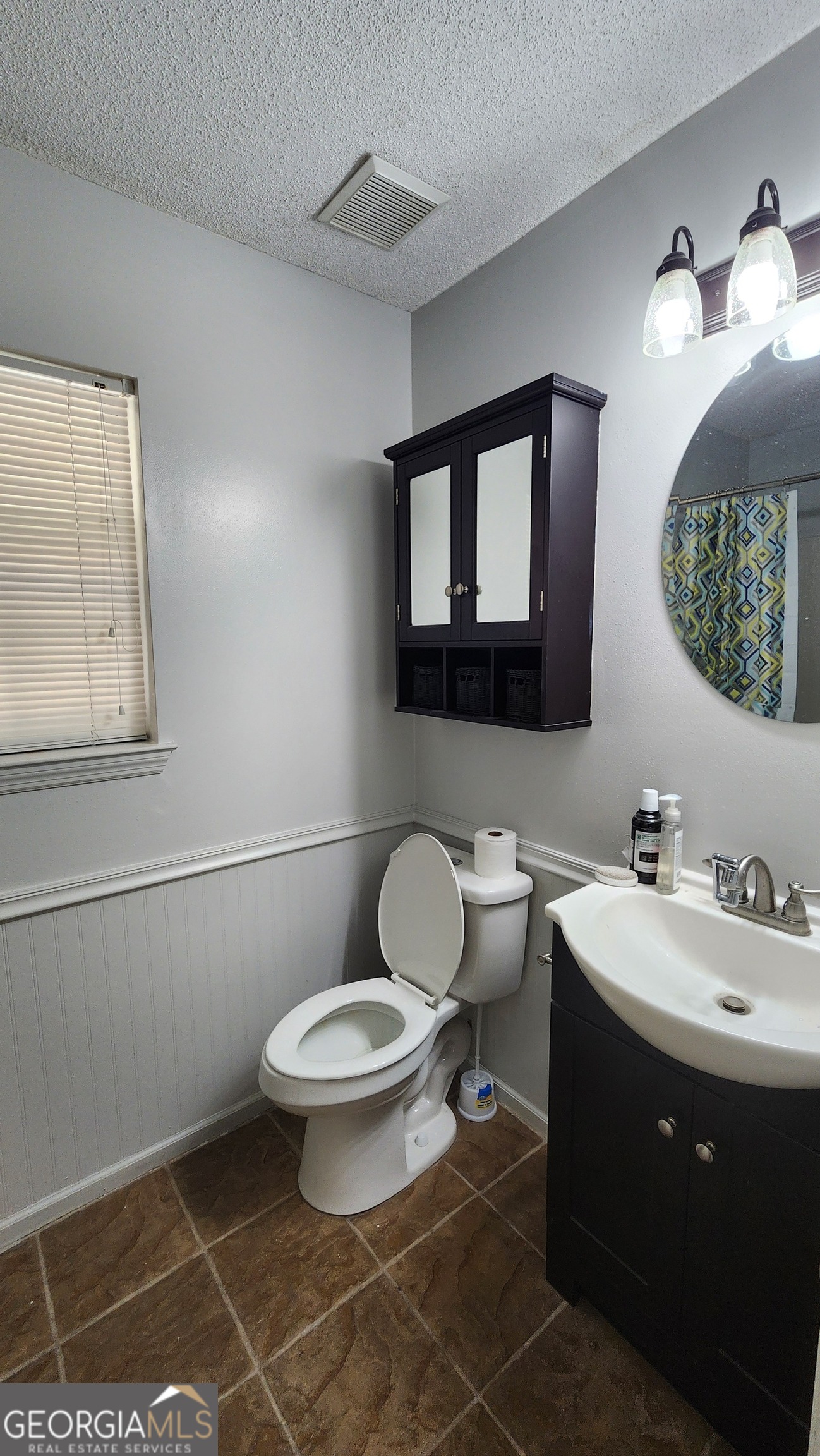 113 Almond Circle Kingsland, GA 31548 - Photo 32 of 34 a bathroom with a toilet sink and mirror