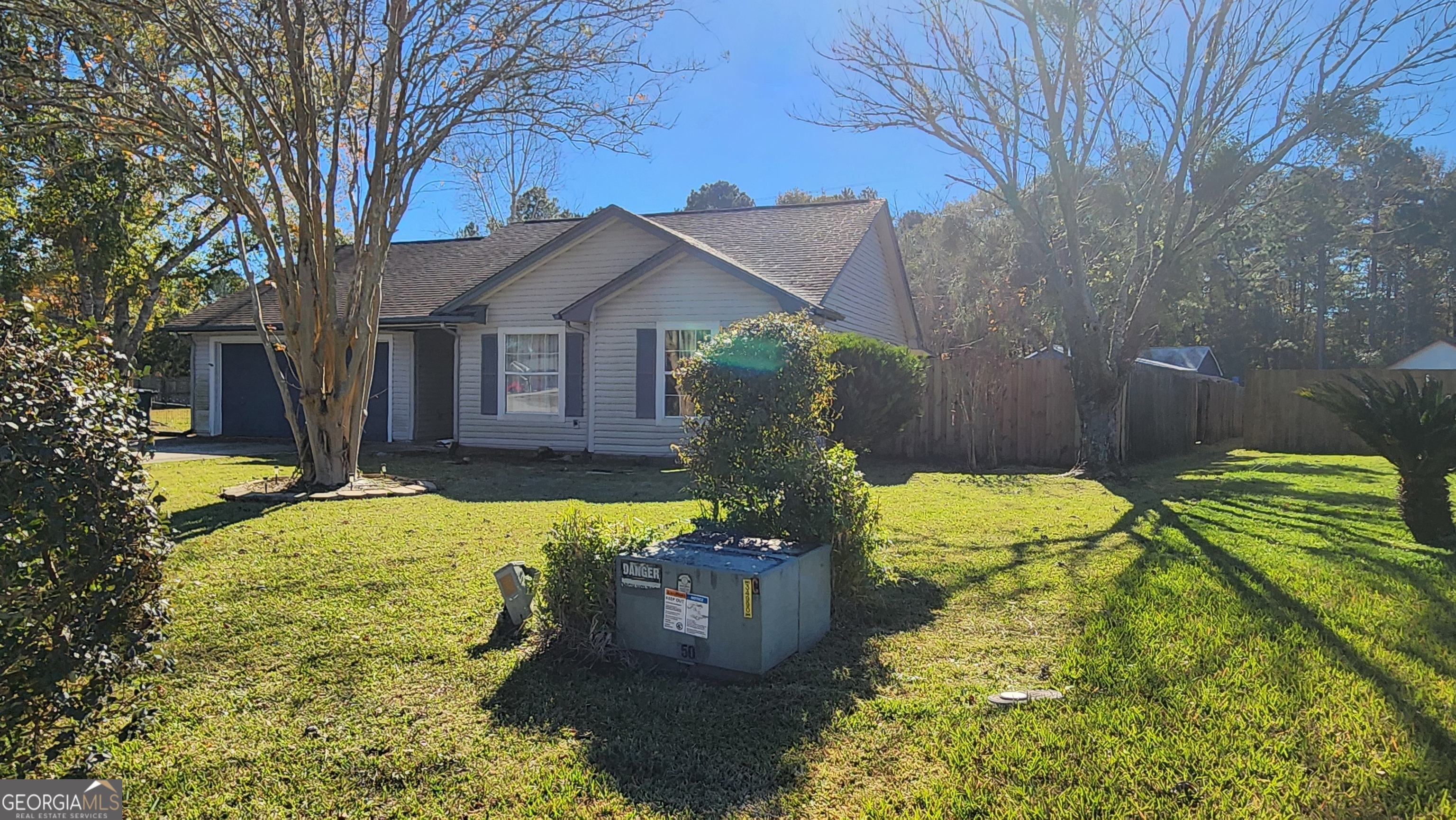 113 Almond Circle Kingsland, GA 31548 - Photo 5 of 34 a front view of a house with a yard
