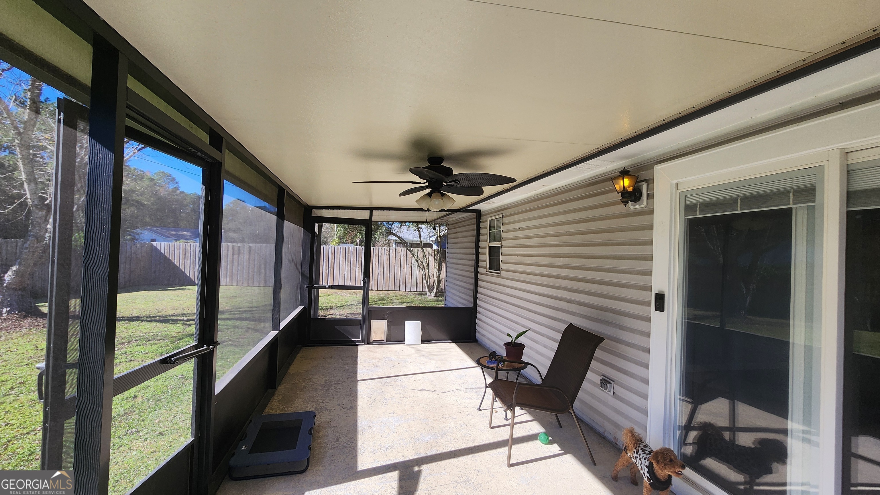 113 Almond Circle Kingsland, GA 31548 - Photo 10 of 34 a porch with seating space