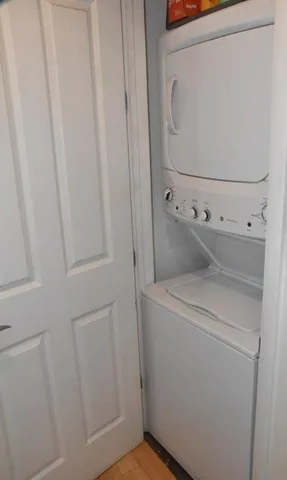 a living room with furniture and floor to ceiling window