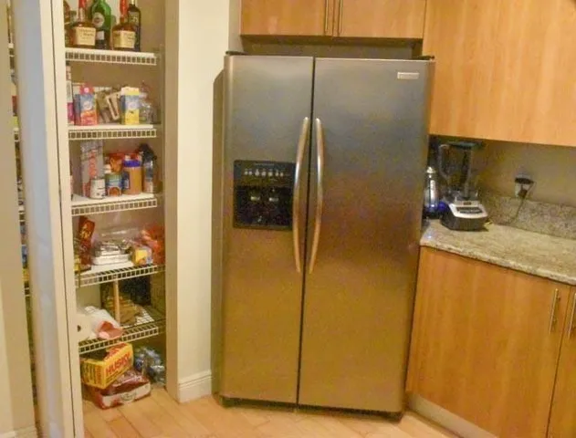 a bathroom with a granite countertop shower and a sink