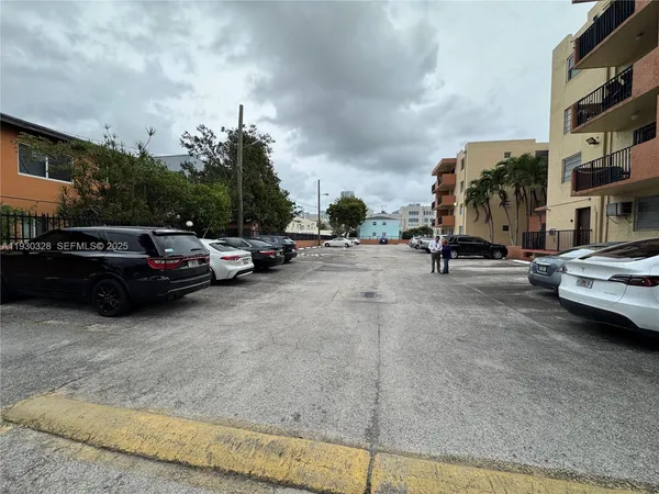 a city street lined with buildings and cars