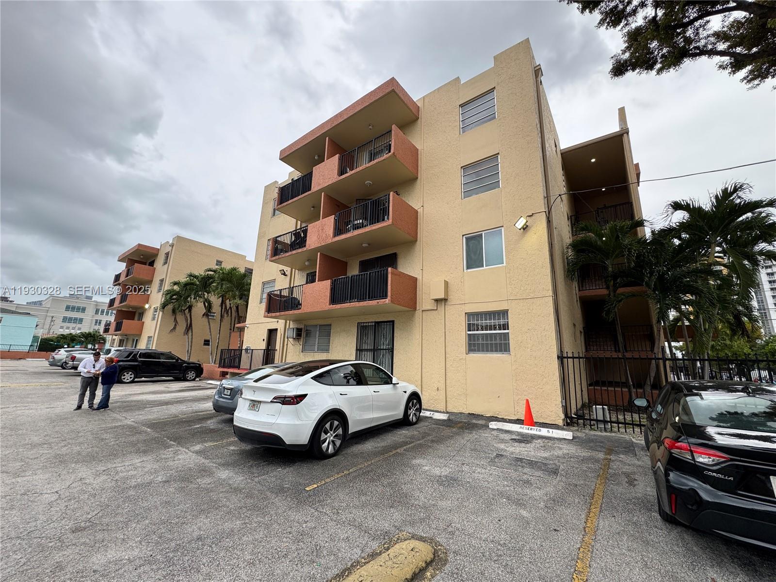 677 Southwest 9th Avenue, Unit 212 Miami, FL 33130 - Photo 16 of 19 a city street lined with buildings and cars