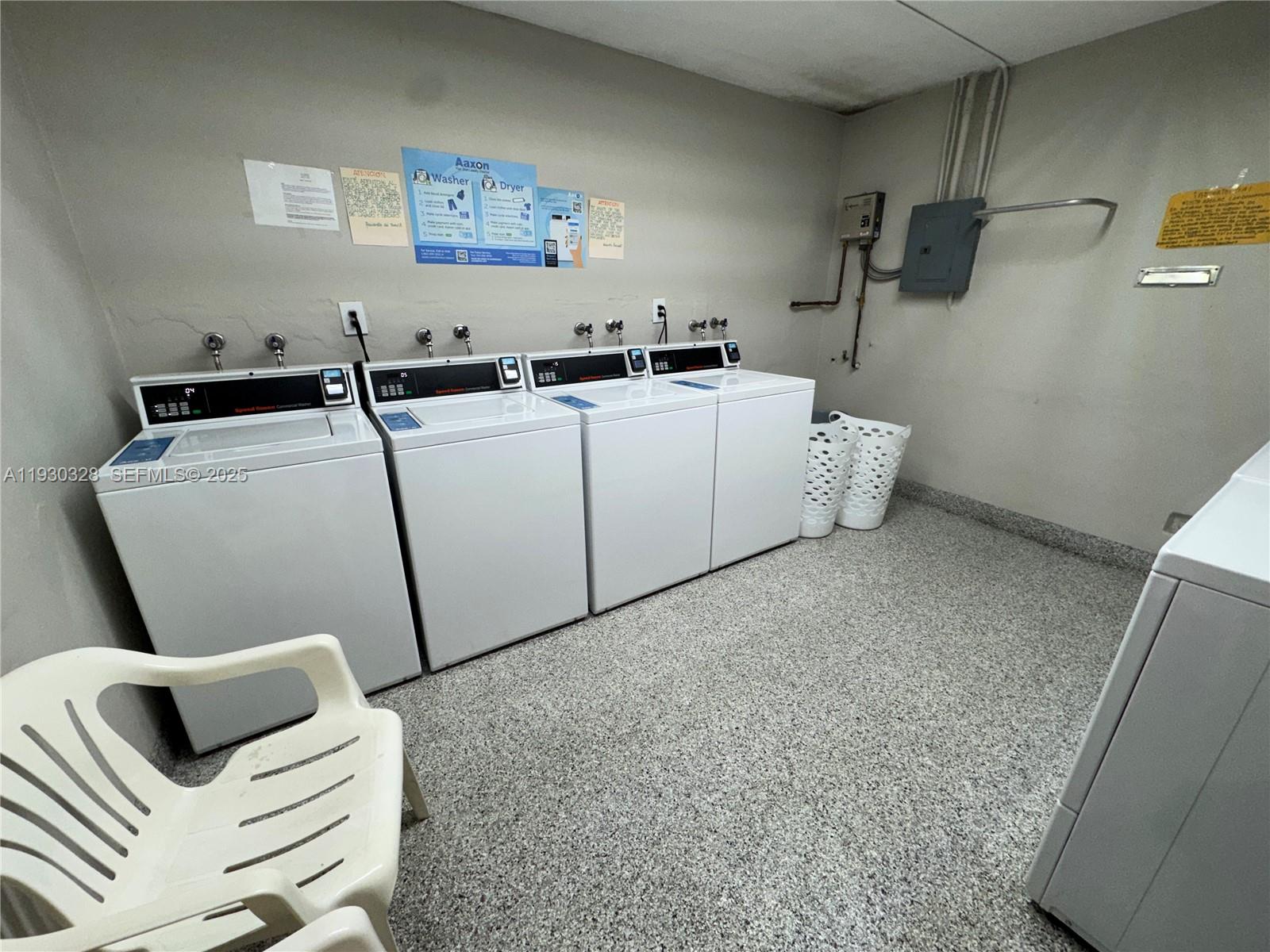 677 Southwest 9th Avenue, Unit 212 Miami, FL 33130 - Photo 19 of 19 a utility room with dryer and washer