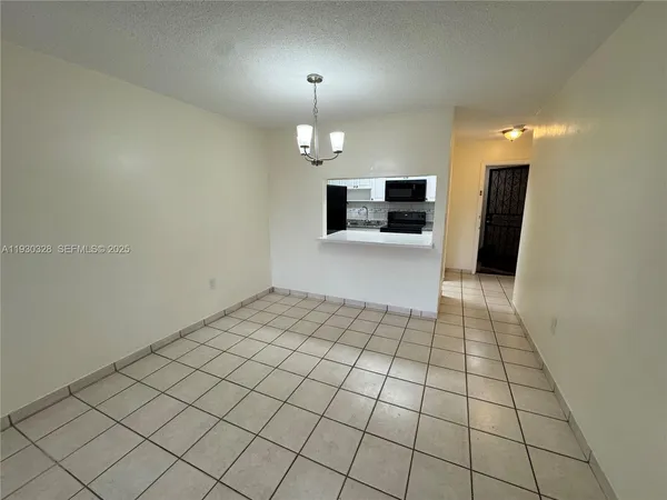 a view of a livingroom and a walk in closet