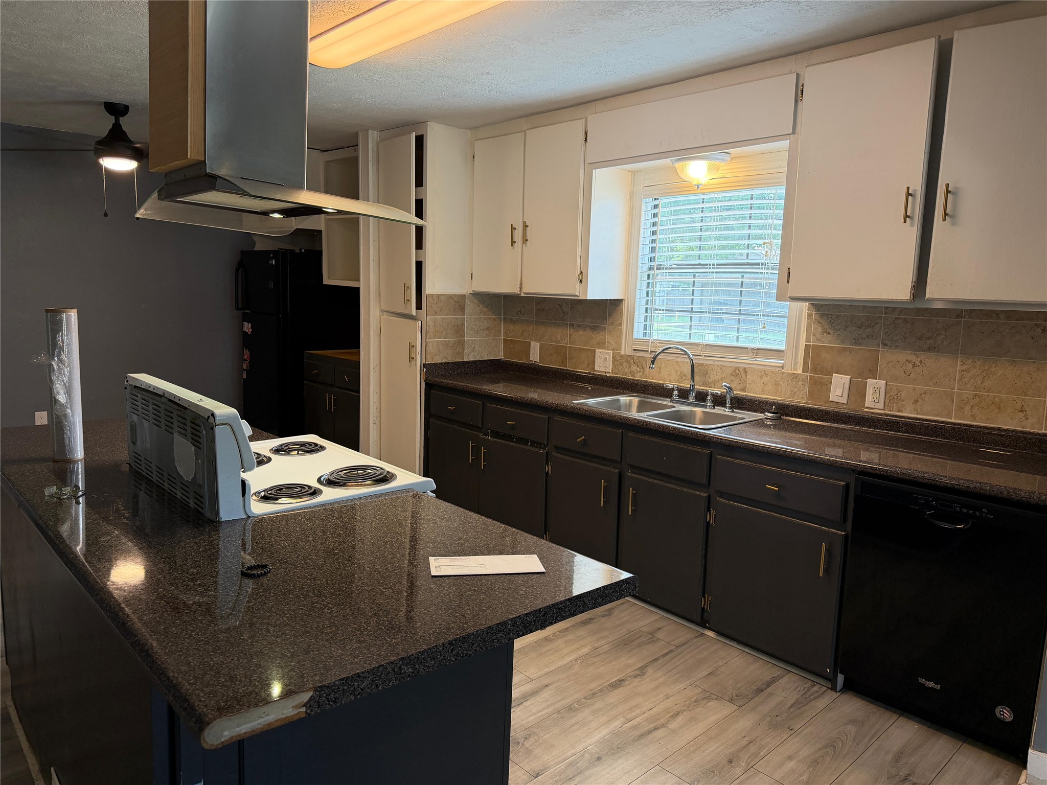 1401 East 29th Street Bryan, TX 77802 - Photo 6 of 13 A well-appointed kitchen features ample counter space, functional appliances, and modern cabinetry.