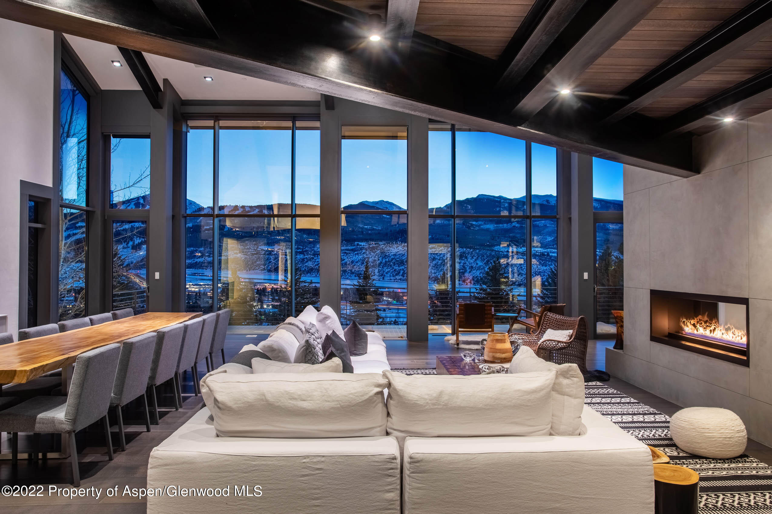 2780 McLain Flats Road Aspen, CO 81612 - Photo 13 of 46 a living room with patio furniture and a fireplace