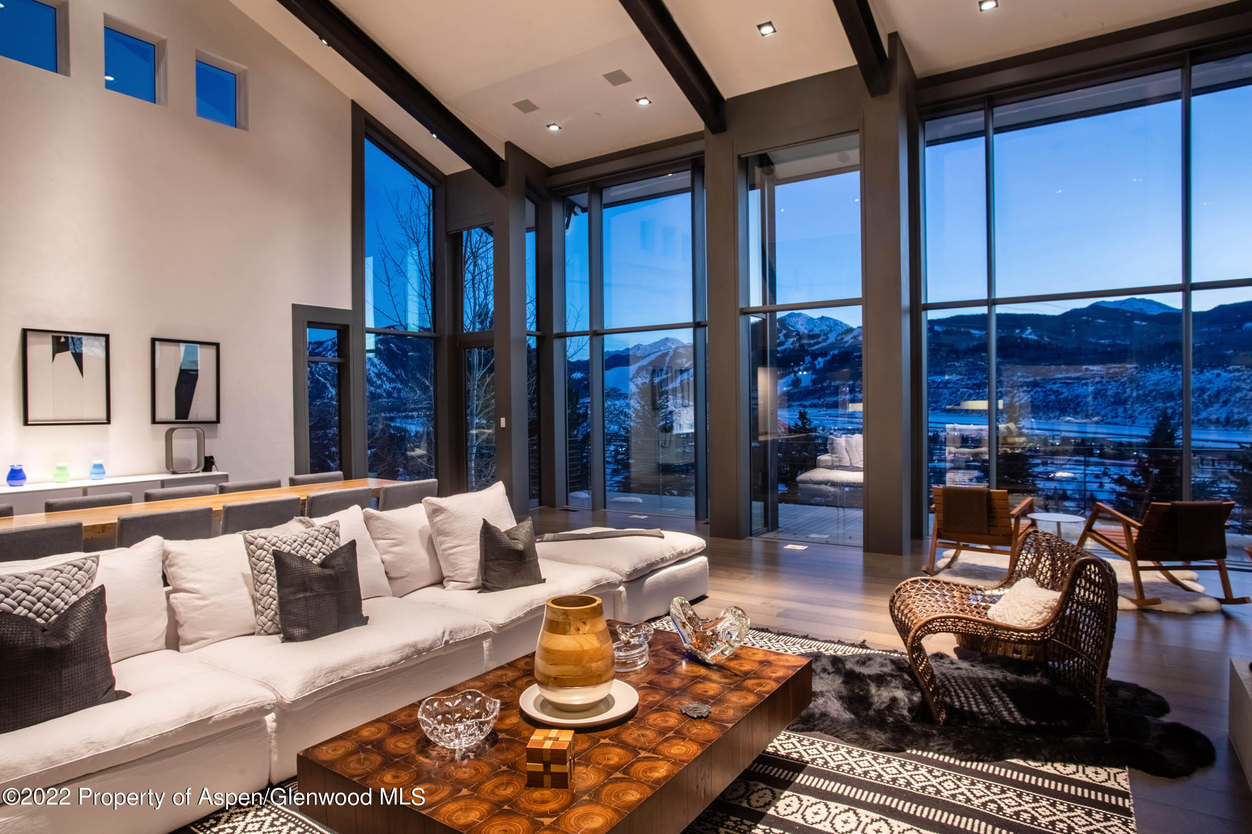 2780 McLain Flats Road Aspen, CO 81612 - Photo 2 of 46 a living room with furniture fireplace and a large window