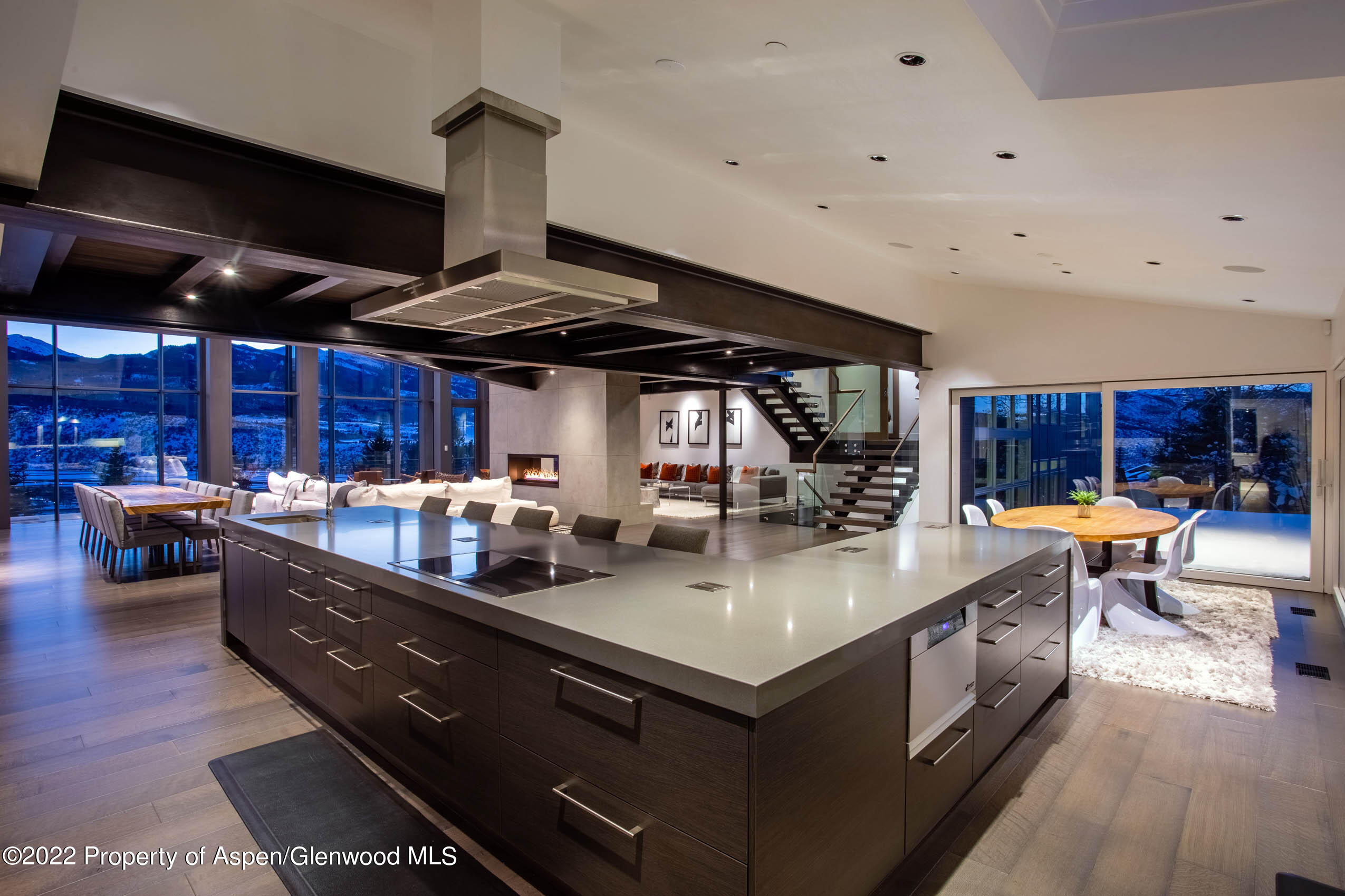2780 McLain Flats Road Aspen, CO 81612 - Photo 23 of 46 a kitchen with stainless steel appliances granite countertop a lot of counter space and wooden floors
