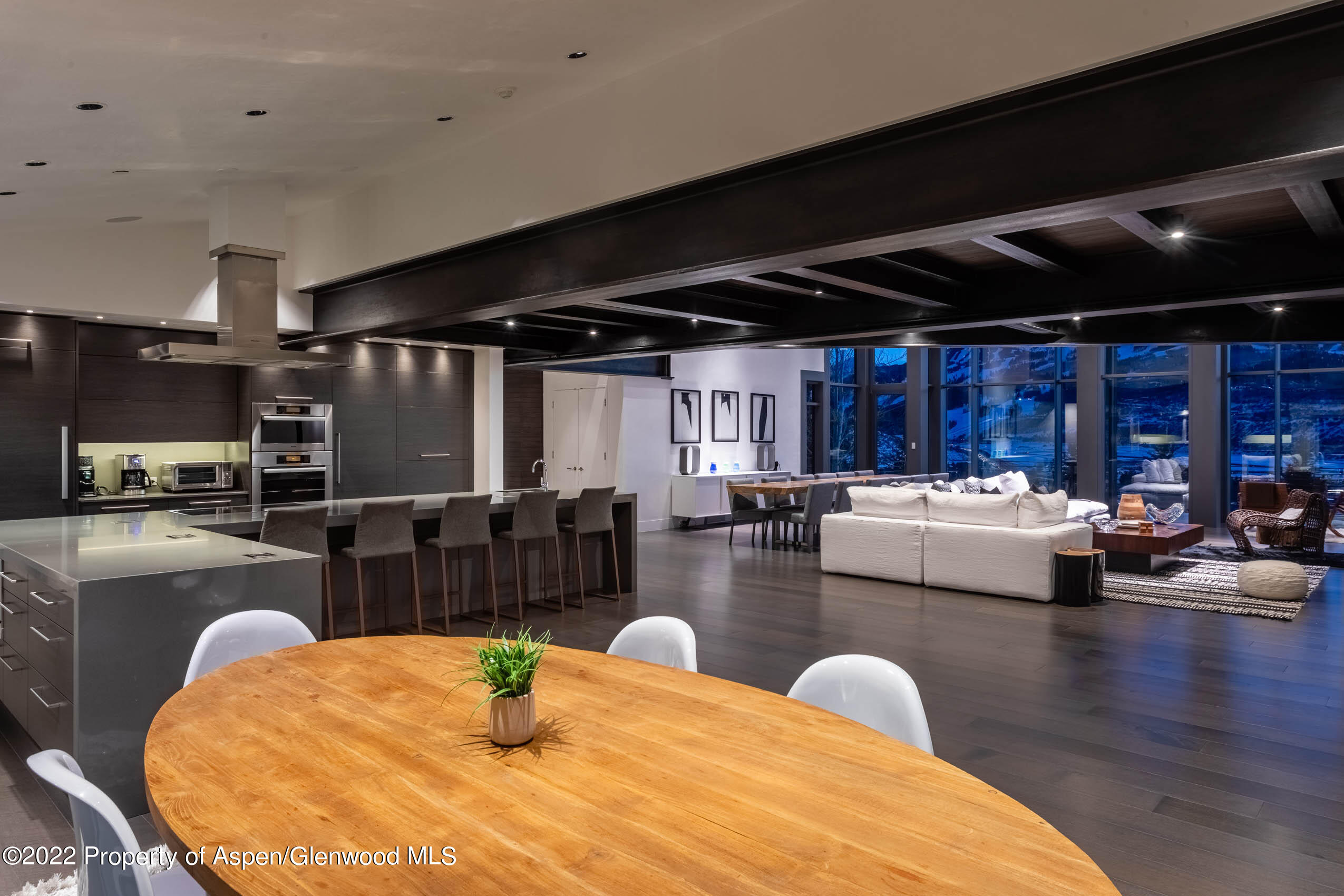 2780 McLain Flats Road Aspen, CO 81612 - Photo 27 of 46 a kitchen with counter top space a sink and living room view