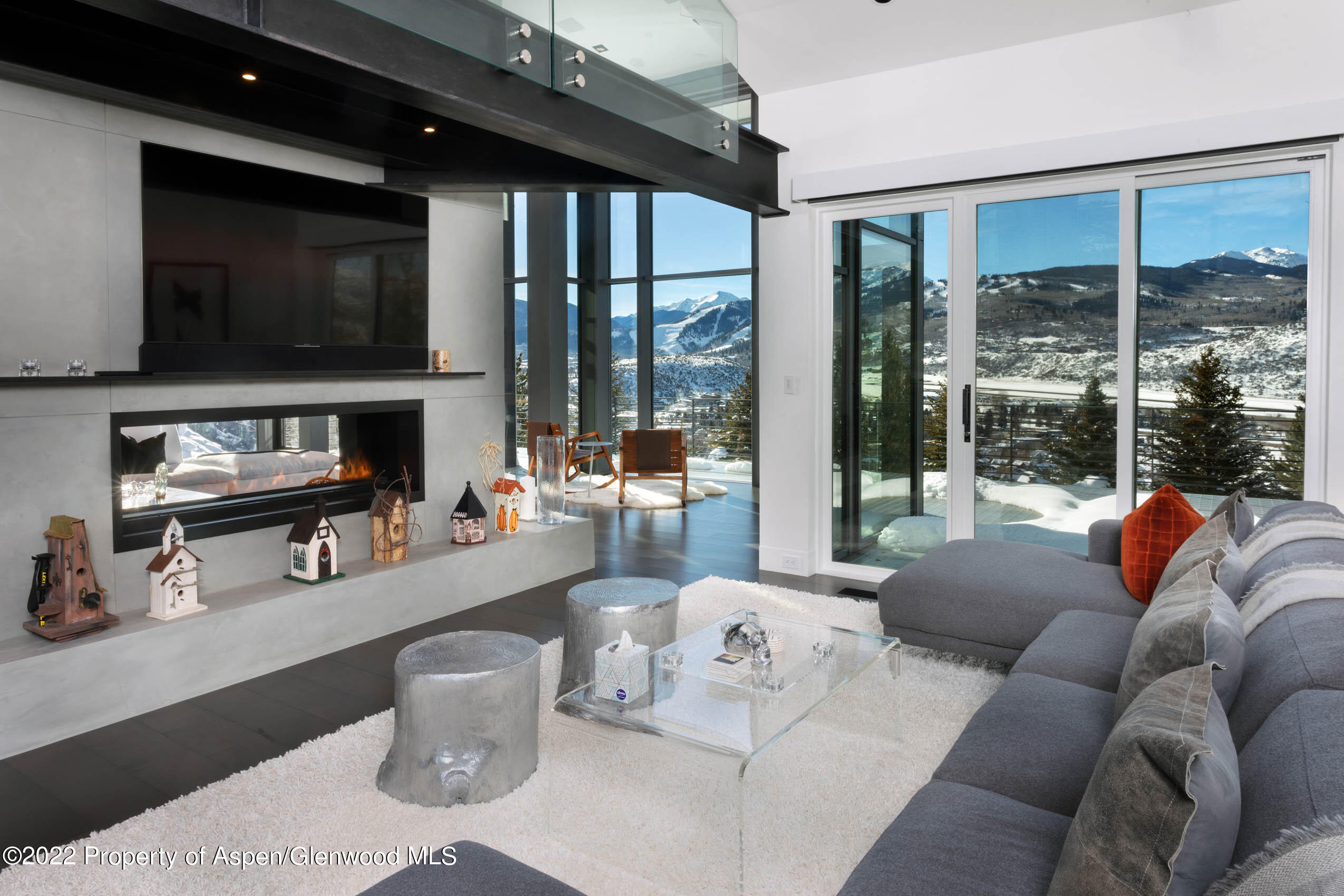 2780 McLain Flats Road Aspen, CO 81612 - Photo 29 of 46 a living room with furniture and a flat screen tv