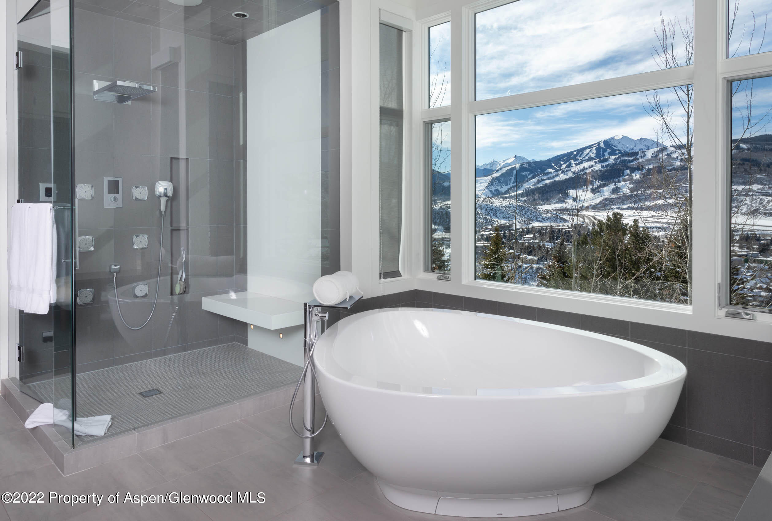 2780 McLain Flats Road Aspen, CO 81612 - Photo 31 of 46 a white bath tub sitting next to a shower