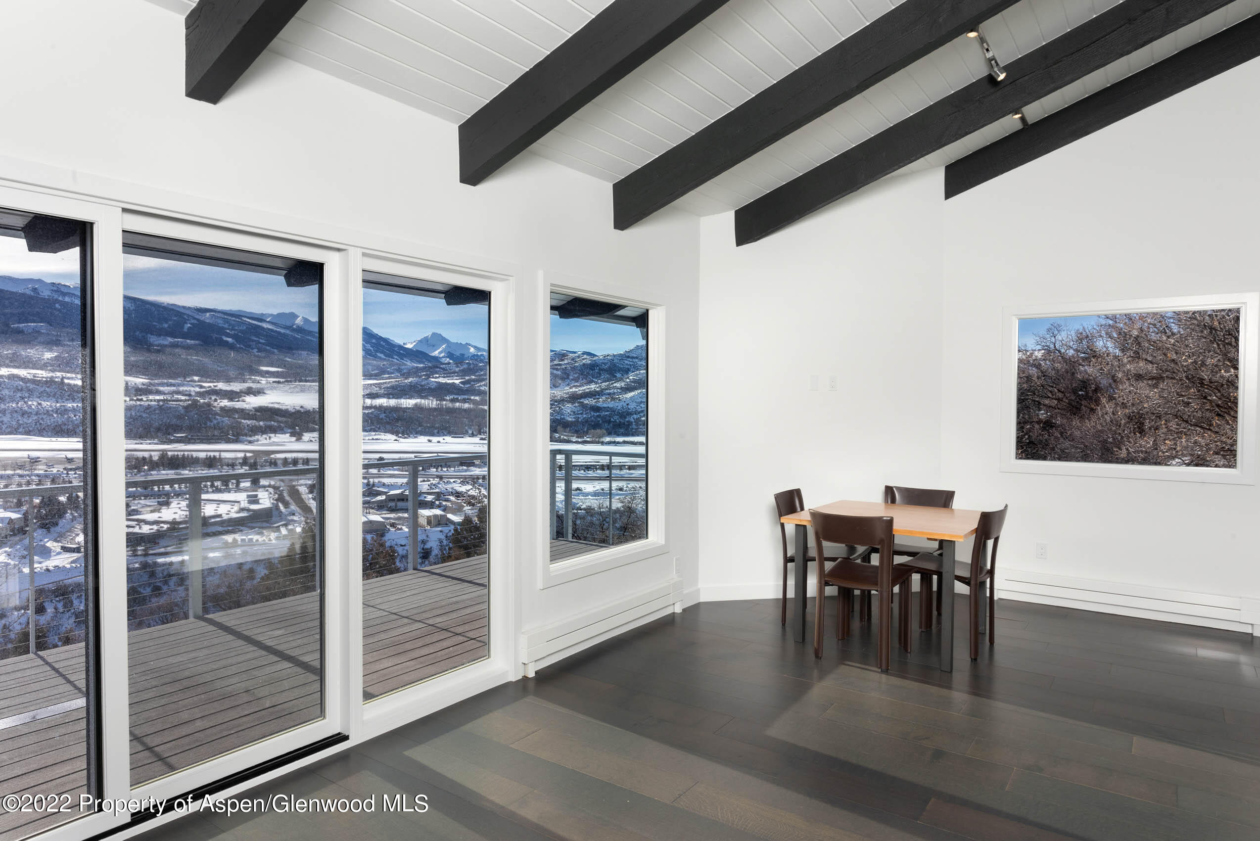 2780 McLain Flats Road Aspen, CO 81612 - Photo 43 of 46 a dining room with furniture and floor to ceiling window