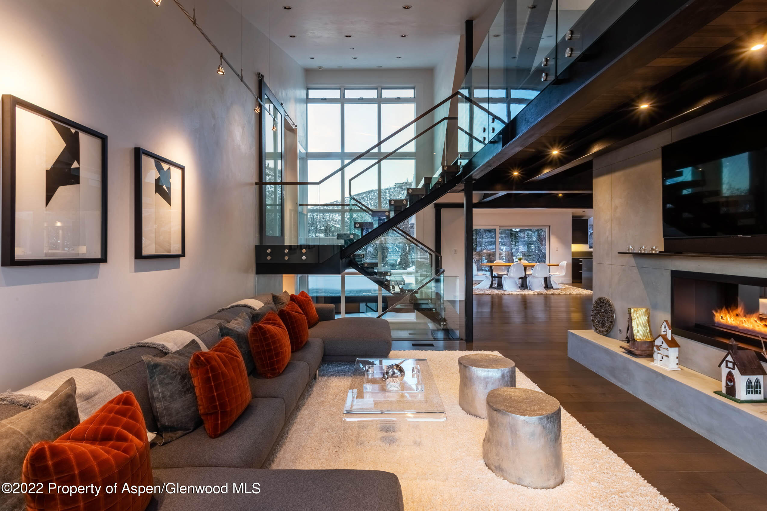 2780 McLain Flats Road Aspen, CO 81612 - Photo 7 of 46 a living room with furniture fireplace and a flat screen tv