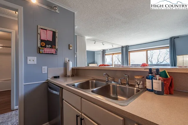 a kitchen that has a sink and a window