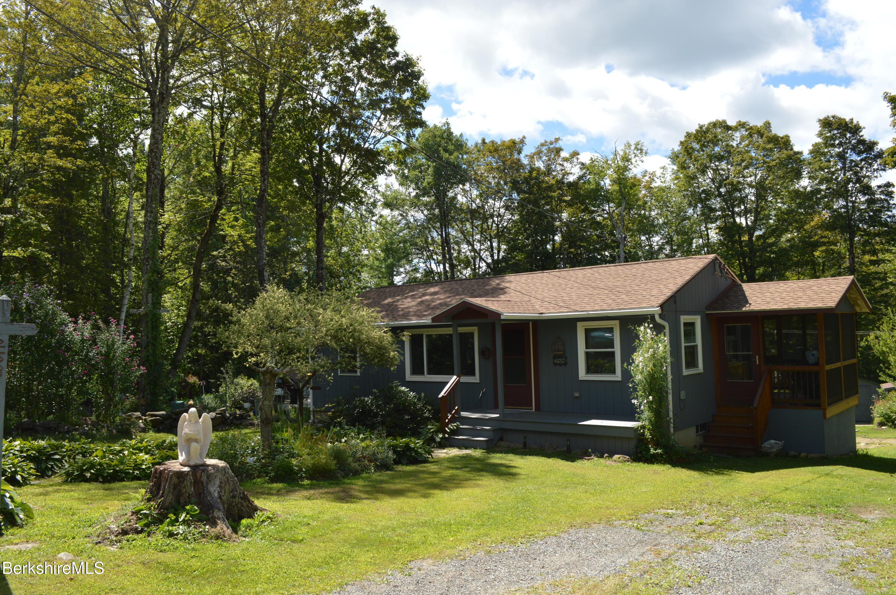 258 Wells Road Becket, MA 01223 - Photo 9 of 43 Screened Sitting porch 9