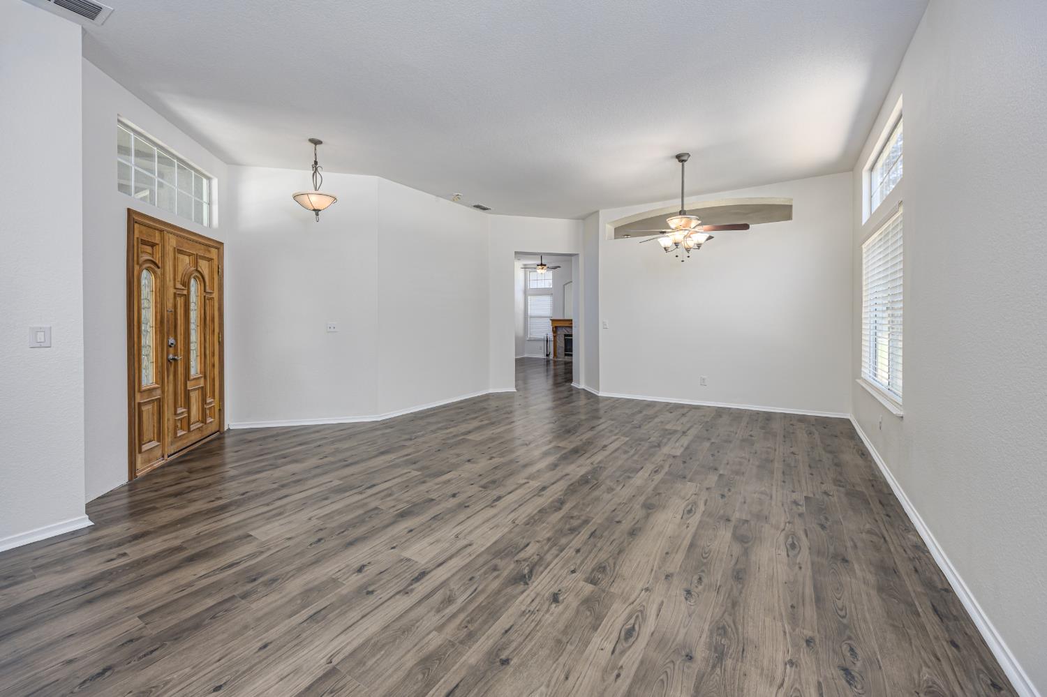 9282 Dever Circle Elk Grove, CA 95624 - Photo 14 of 38 LIVING ROOM AND FORMAL DINING AREA
