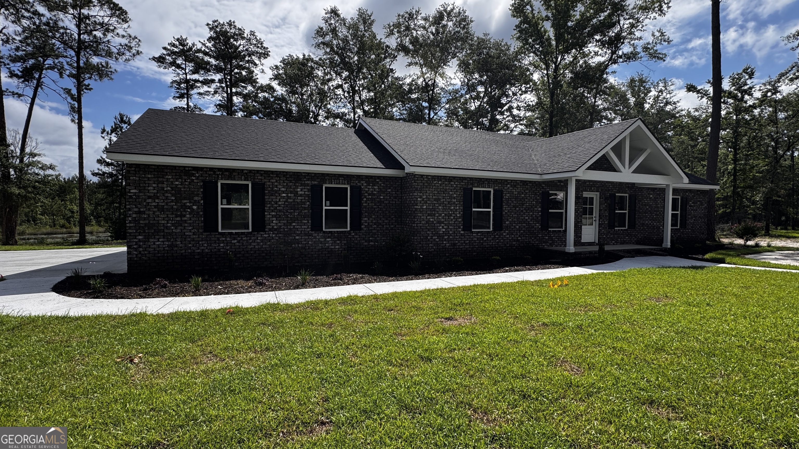3 Willow Pointe Claxton, GA 30417 - Photo 3 of 31 a front view of a house with a yard