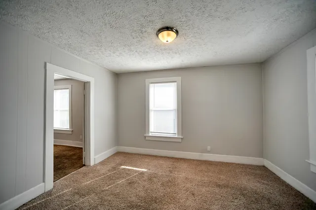 an empty room with windows