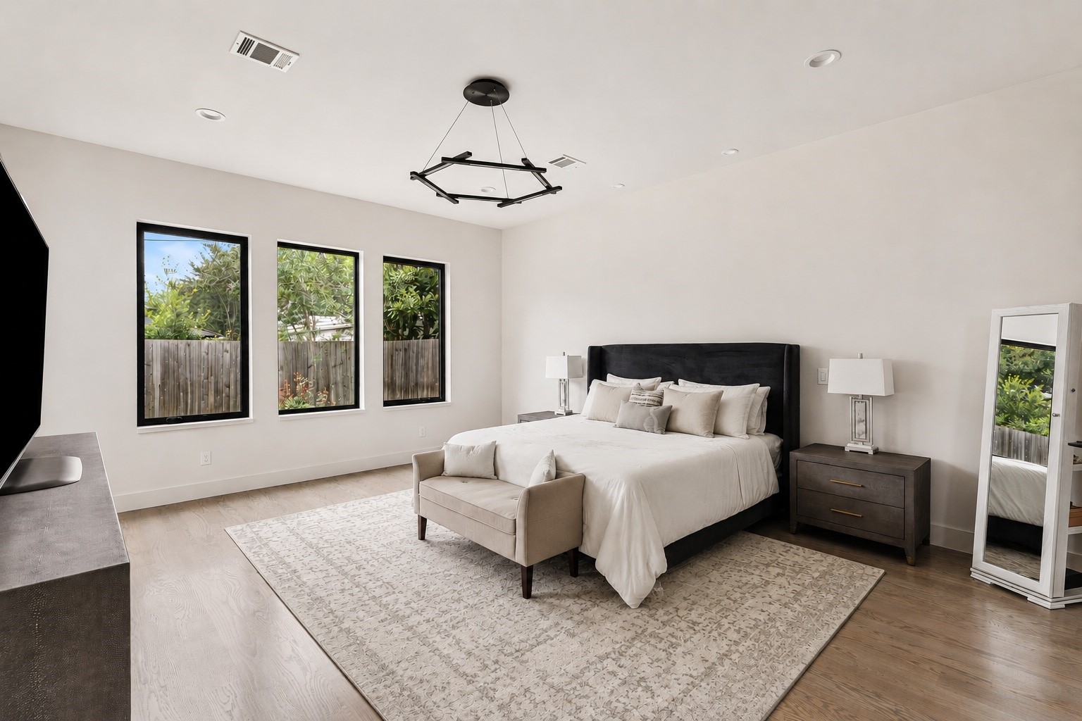 4638 Merwin Street Houston, TX 77027 - Photo 17 of 42 Privately situated on the first floor, the primary suite provides comfort, privacy, and convenient main-level living.