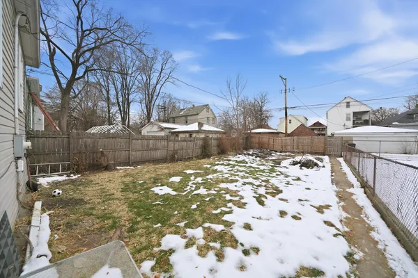 a view of a backyard of the house