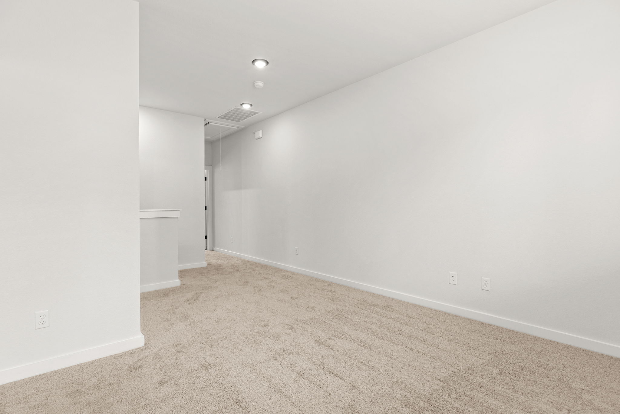 2600 Gattis School Road, Unit 1001 Round Rock, TX 78664 - Photo 24 of 40 An airy room offers plush carpeting and discreet recessed lighting.