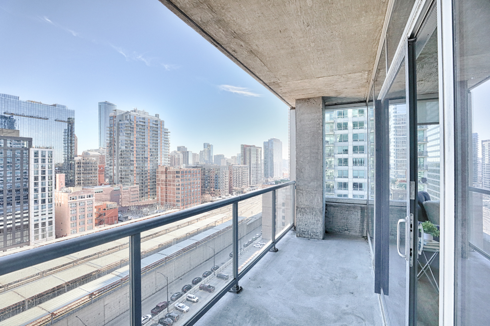 611 South Wells Street, Unit 1507 Chicago, IL 60607 - Photo 18 of 20 a view of a city from a balcony