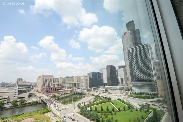 611 South Wells Street, Unit 1507 Chicago, IL 60607 - Photo 19 of 20 a view of a city with tall buildings