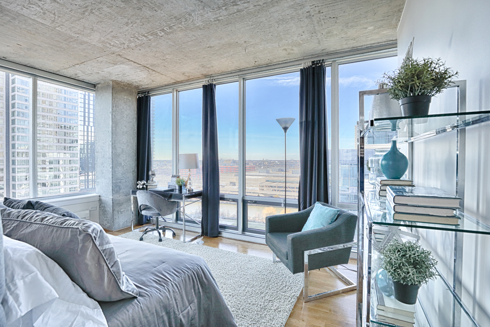611 South Wells Street, Unit 1507 Chicago, IL 60607 - Photo 10 of 20 a bedroom with furniture and large windows