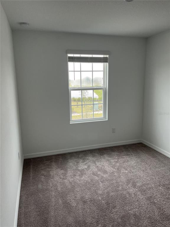 34142 Polacca Lane Wesley Chapel, FL 33543 - Photo 11 of 30 an empty room with a window