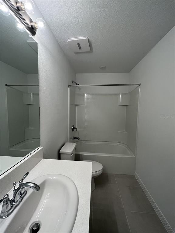 34142 Polacca Lane Wesley Chapel, FL 33543 - Photo 19 of 30 a bathroom with a sink a toilet and shower