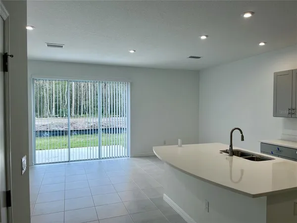a view of a sink and a faucet in a room