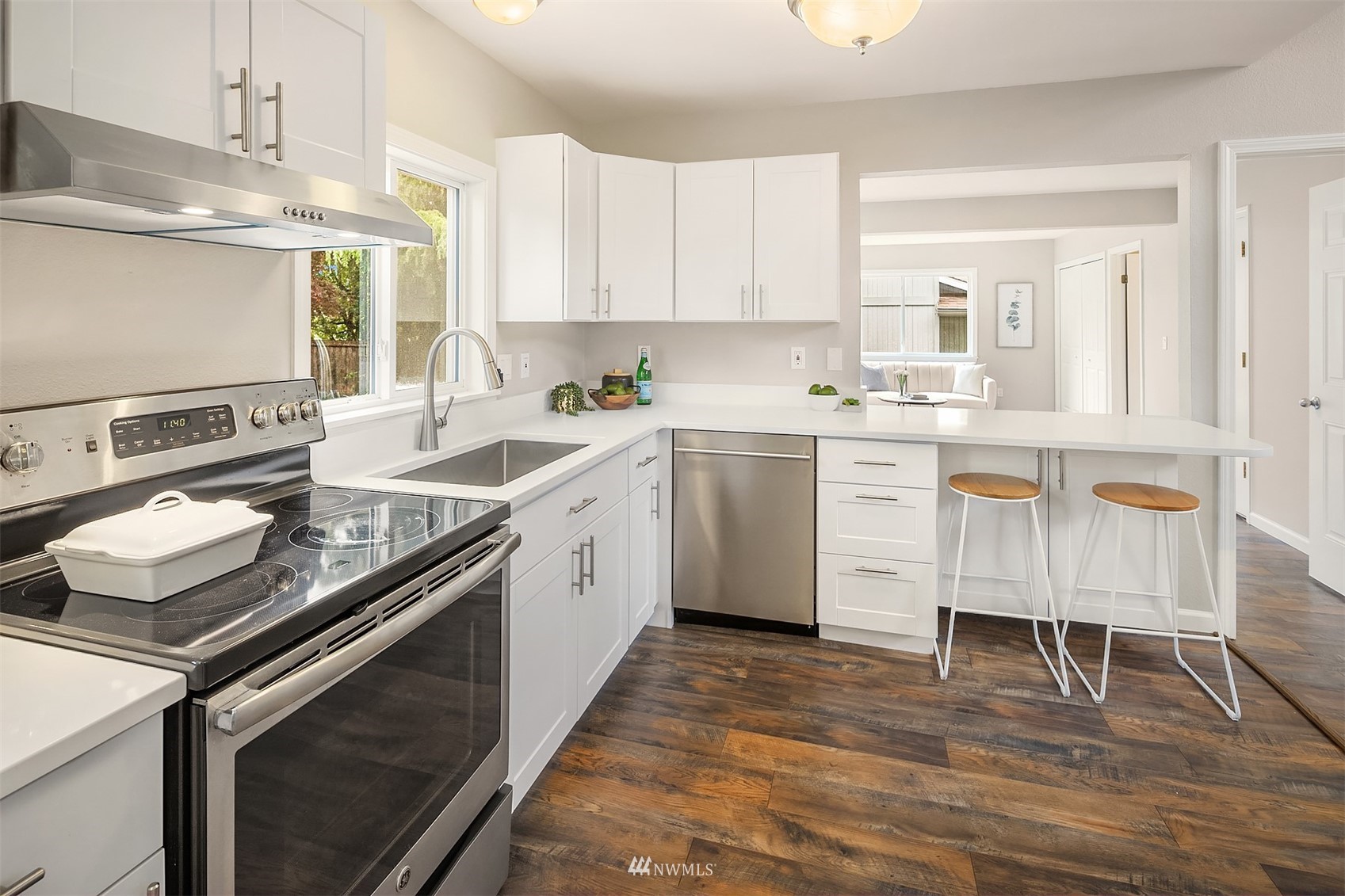 9009 Northeast 138th Place Kirkland, WA 98034 - Photo 11 of 30 a kitchen with a sink appliances and cabinets
