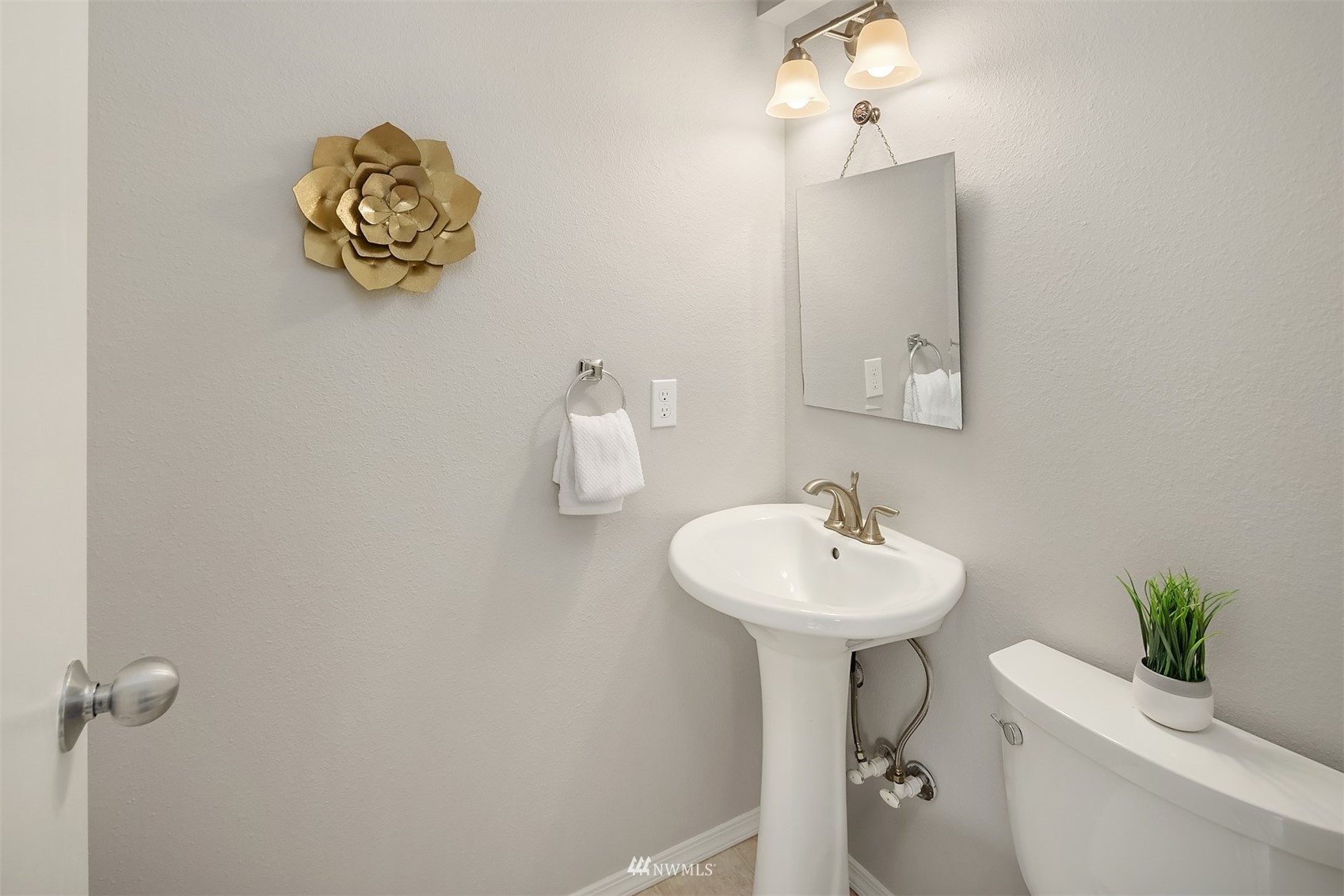 9009 Northeast 138th Place Kirkland, WA 98034 - Photo 15 of 30 a bathroom with a sink a mirror and a toilet