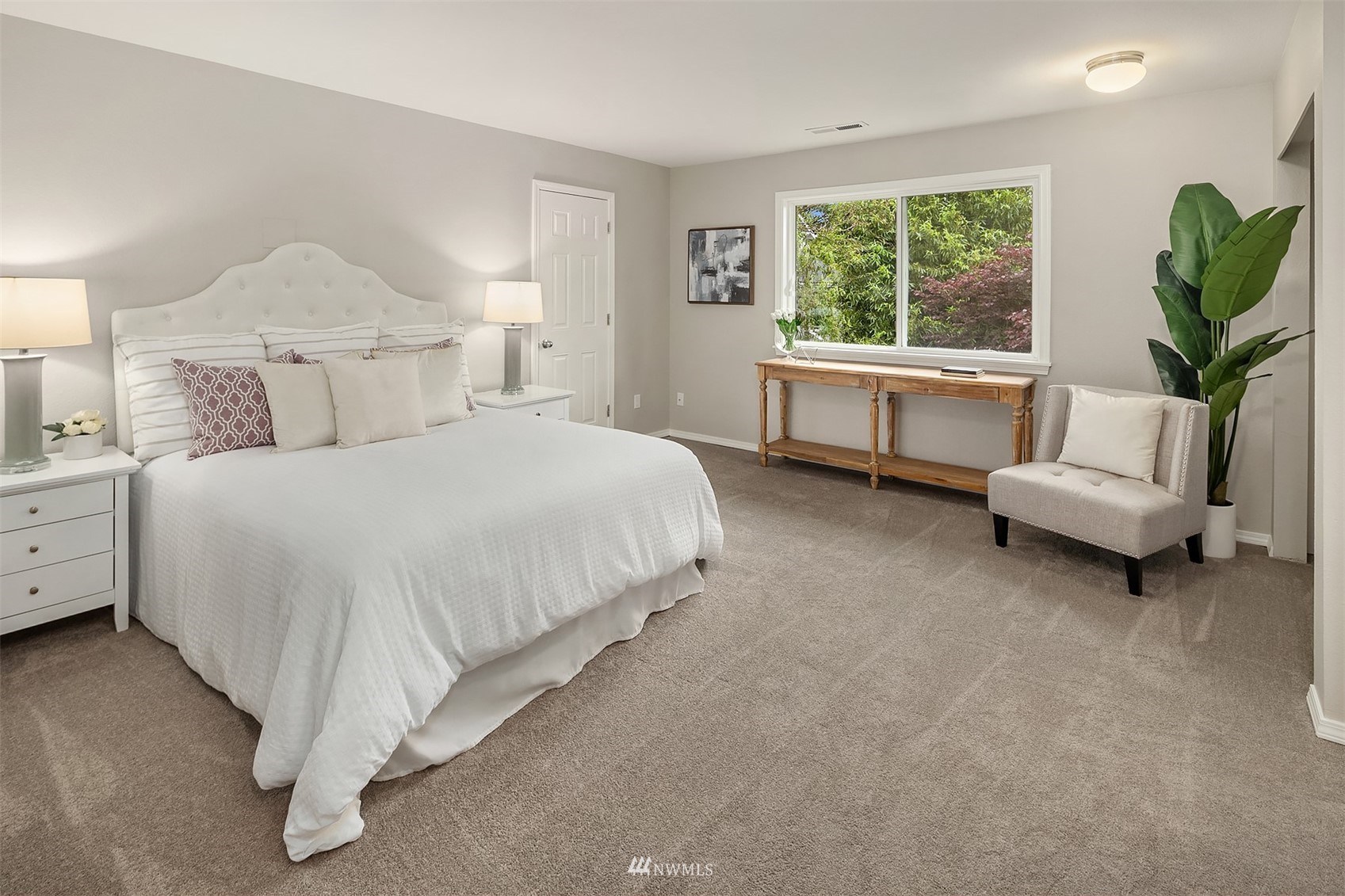 9009 Northeast 138th Place Kirkland, WA 98034 - Photo 16 of 30 a bed room with a bed and a couch