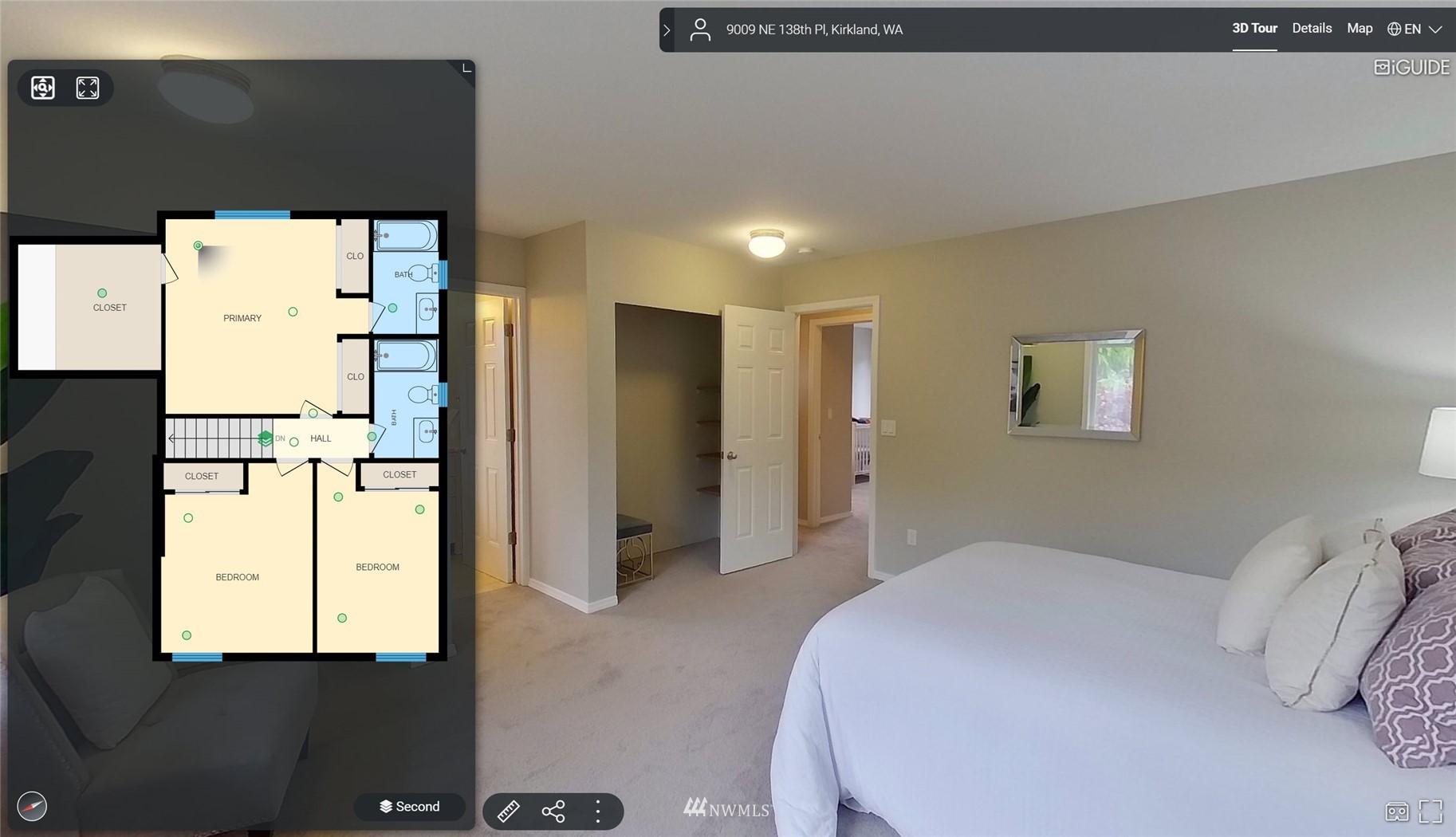 9009 Northeast 138th Place Kirkland, WA 98034 - Photo 19 of 30 a bedroom with a bed and a refrigerator