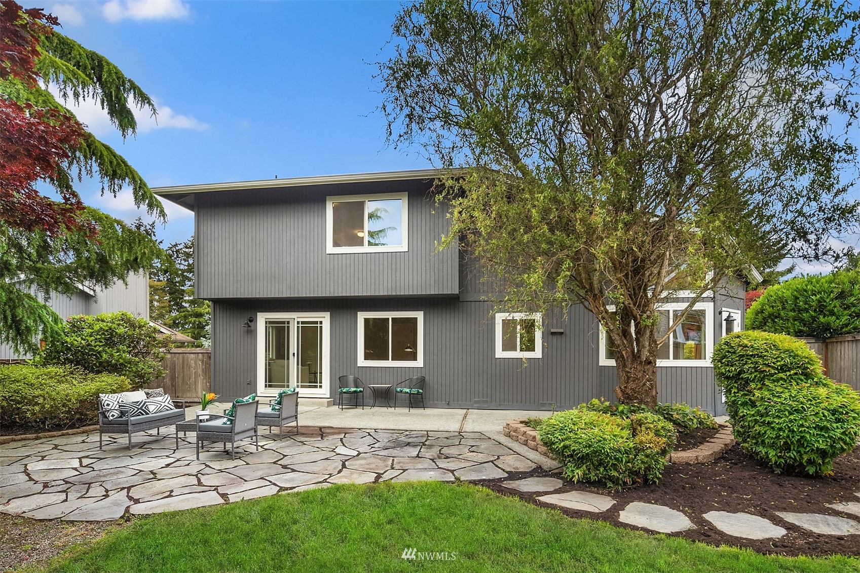 9009 Northeast 138th Place Kirkland, WA 98034 - Photo 23 of 30 a front view of a house with garden