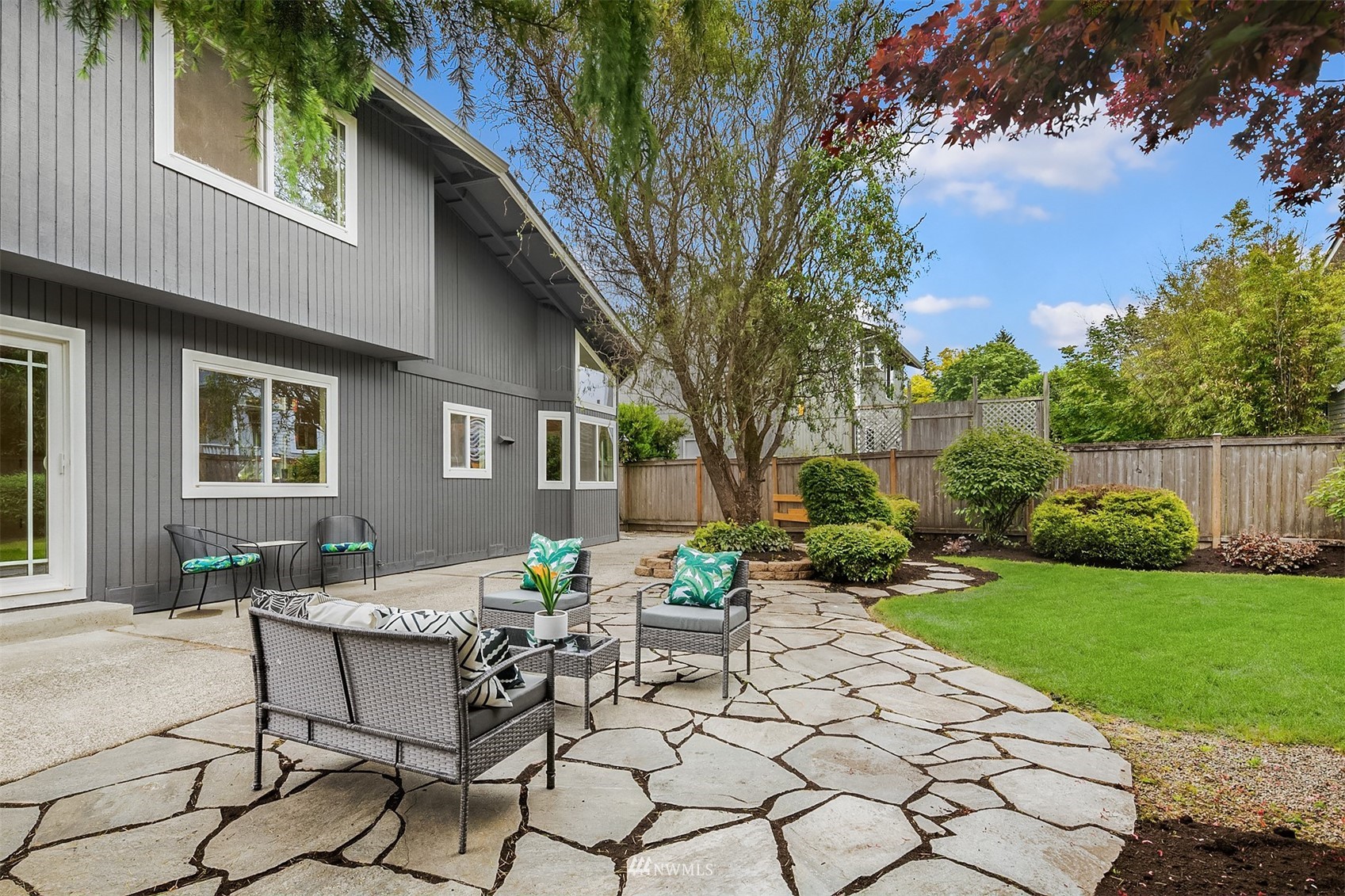 9009 Northeast 138th Place Kirkland, WA 98034 - Photo 25 of 30 a view of a patio with table and chairs and potted plants
