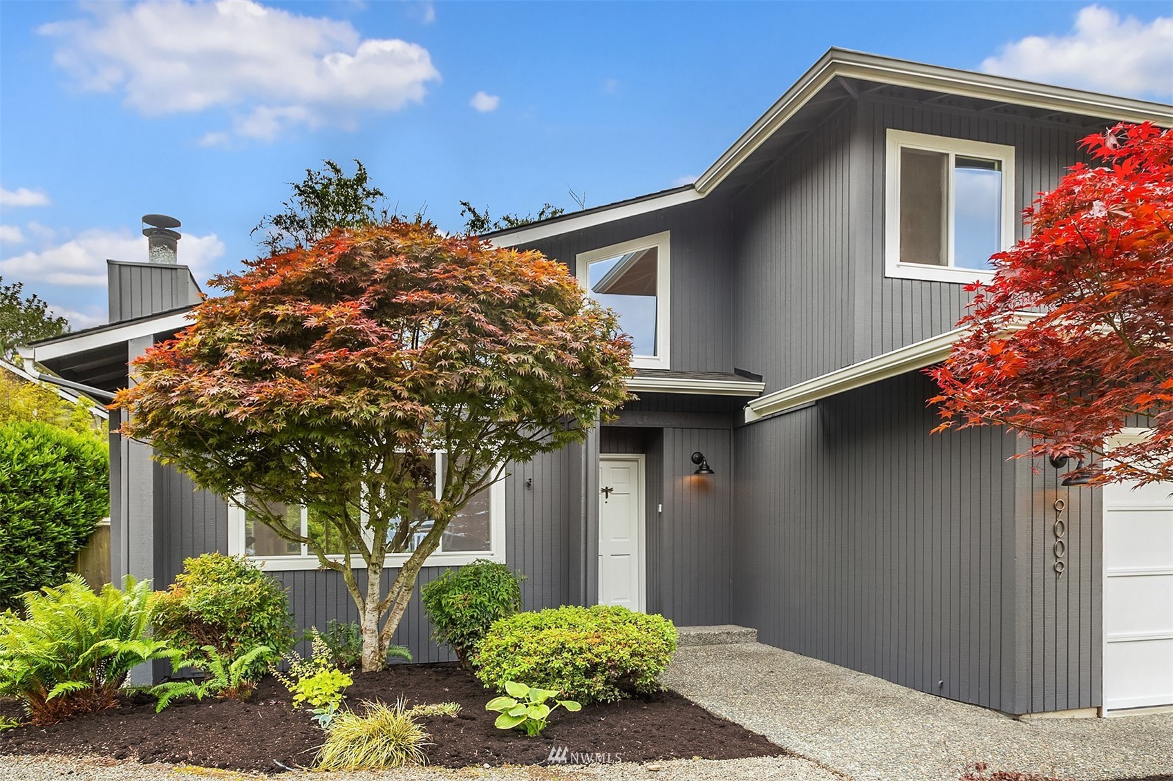 9009 Northeast 138th Place Kirkland, WA 98034 - Photo 26 of 30 a front view of a house with garden