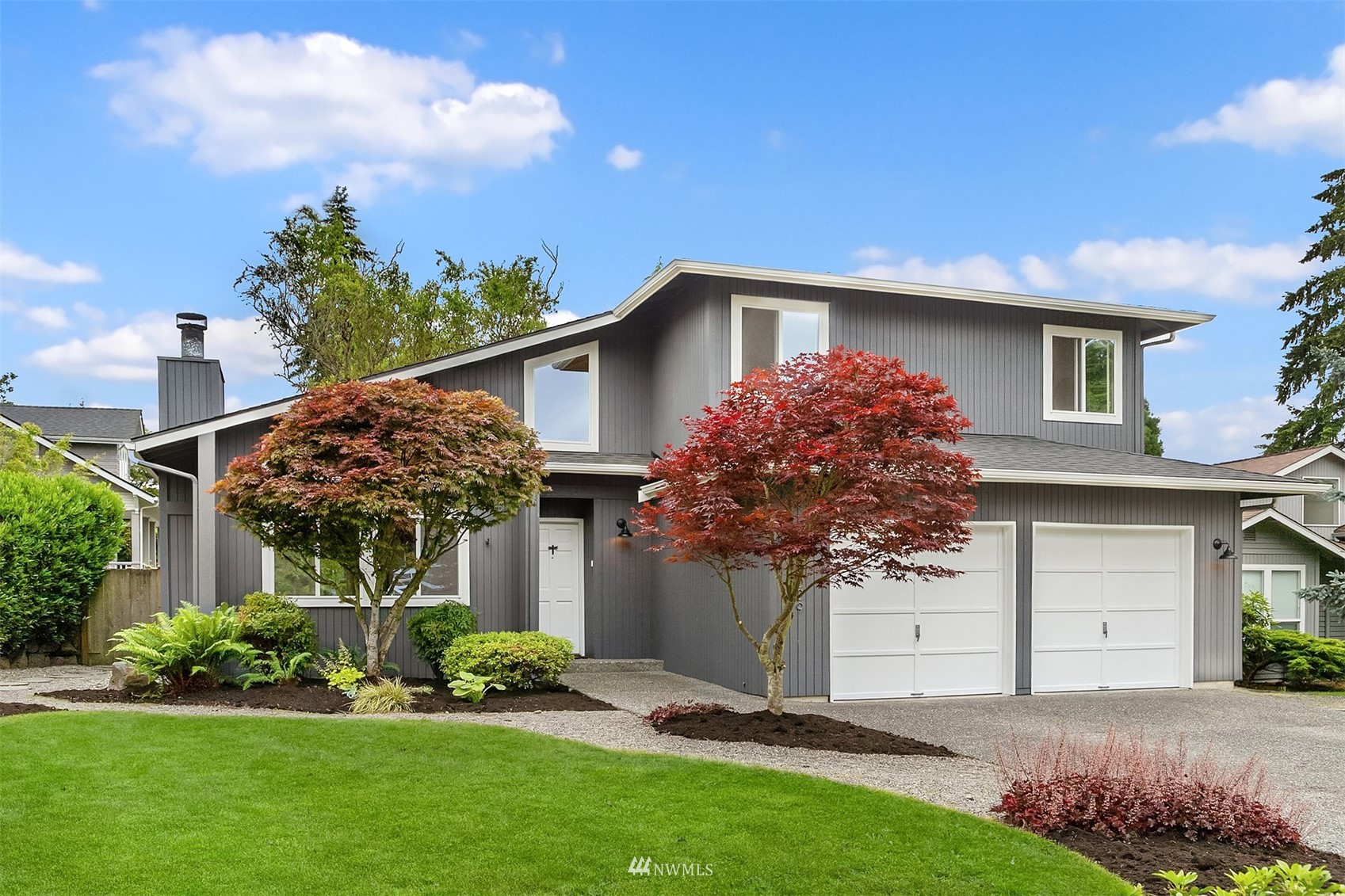 9009 Northeast 138th Place Kirkland, WA 98034 - Photo 29 of 30 a front view of house with a garden