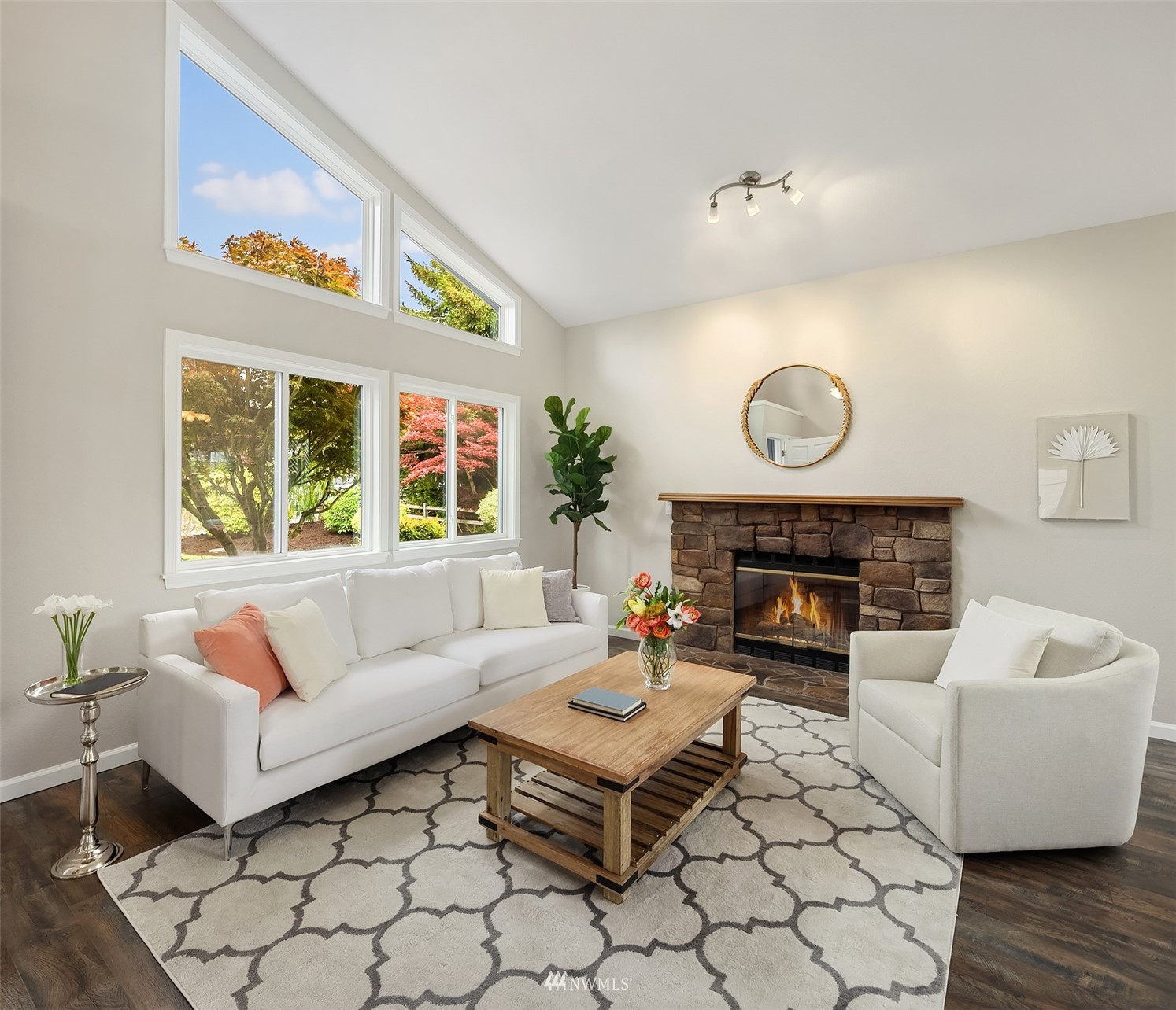 9009 Northeast 138th Place Kirkland, WA 98034 - Photo 3 of 30 a living room with furniture a fireplace and a large window