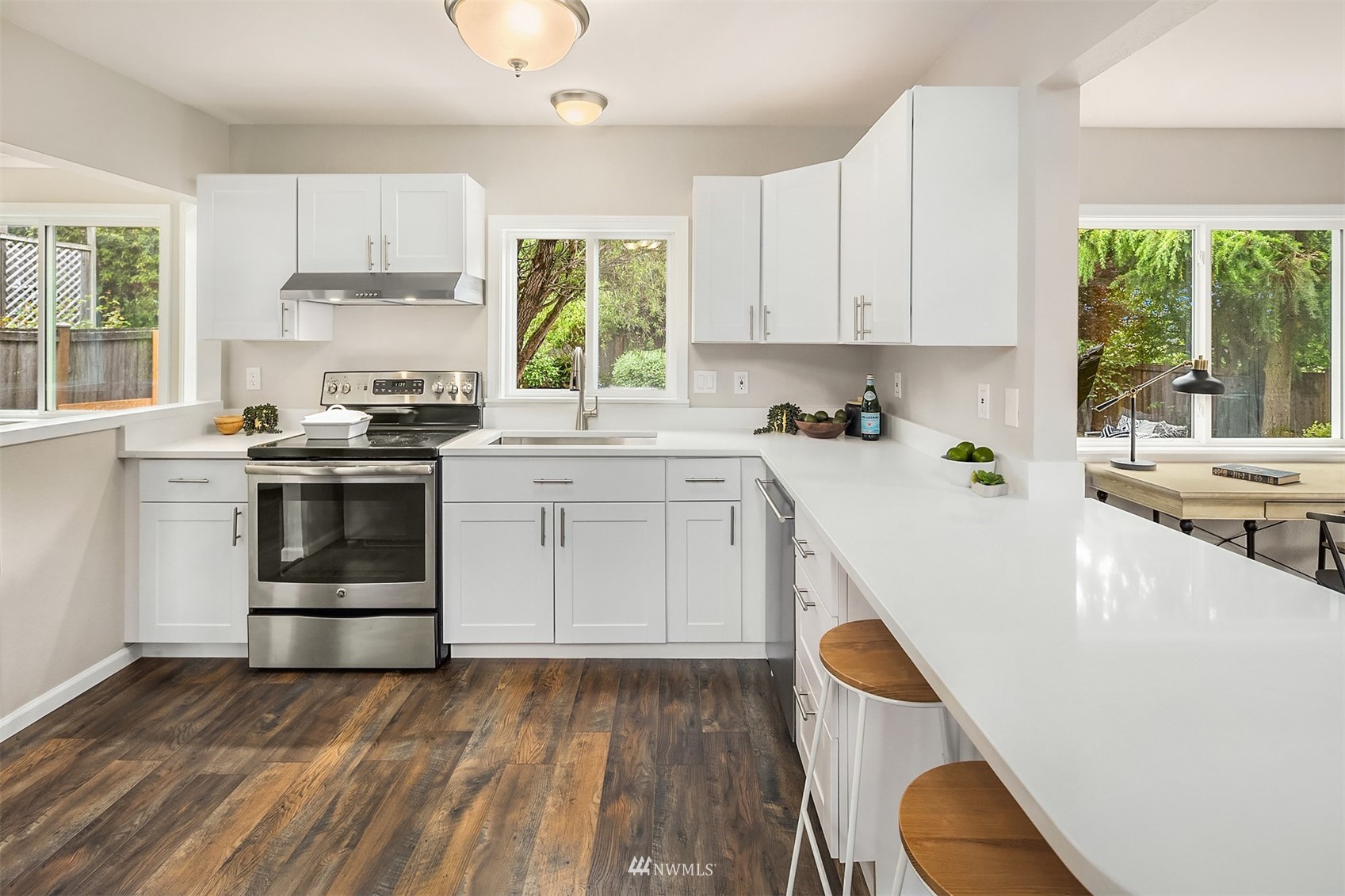 9009 Northeast 138th Place Kirkland, WA 98034 - Photo 6 of 30 a kitchen with a sink a stove and cabinets