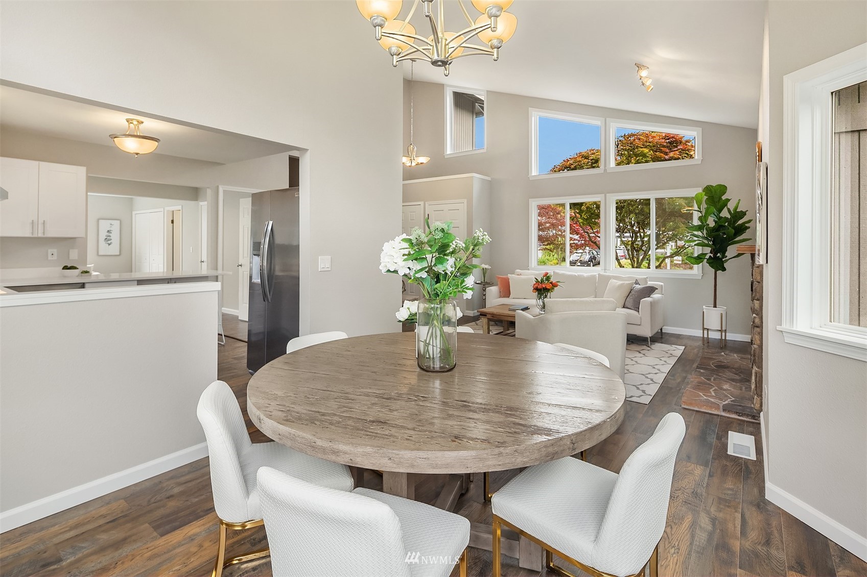 9009 Northeast 138th Place Kirkland, WA 98034 - Photo 9 of 30 a view of a dining room with furniture window and wooden floor