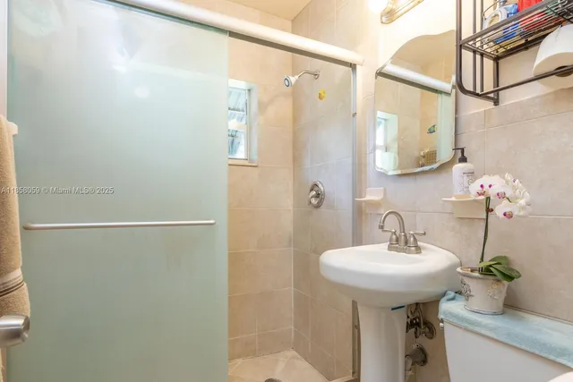 a bathroom with a sink and mirror