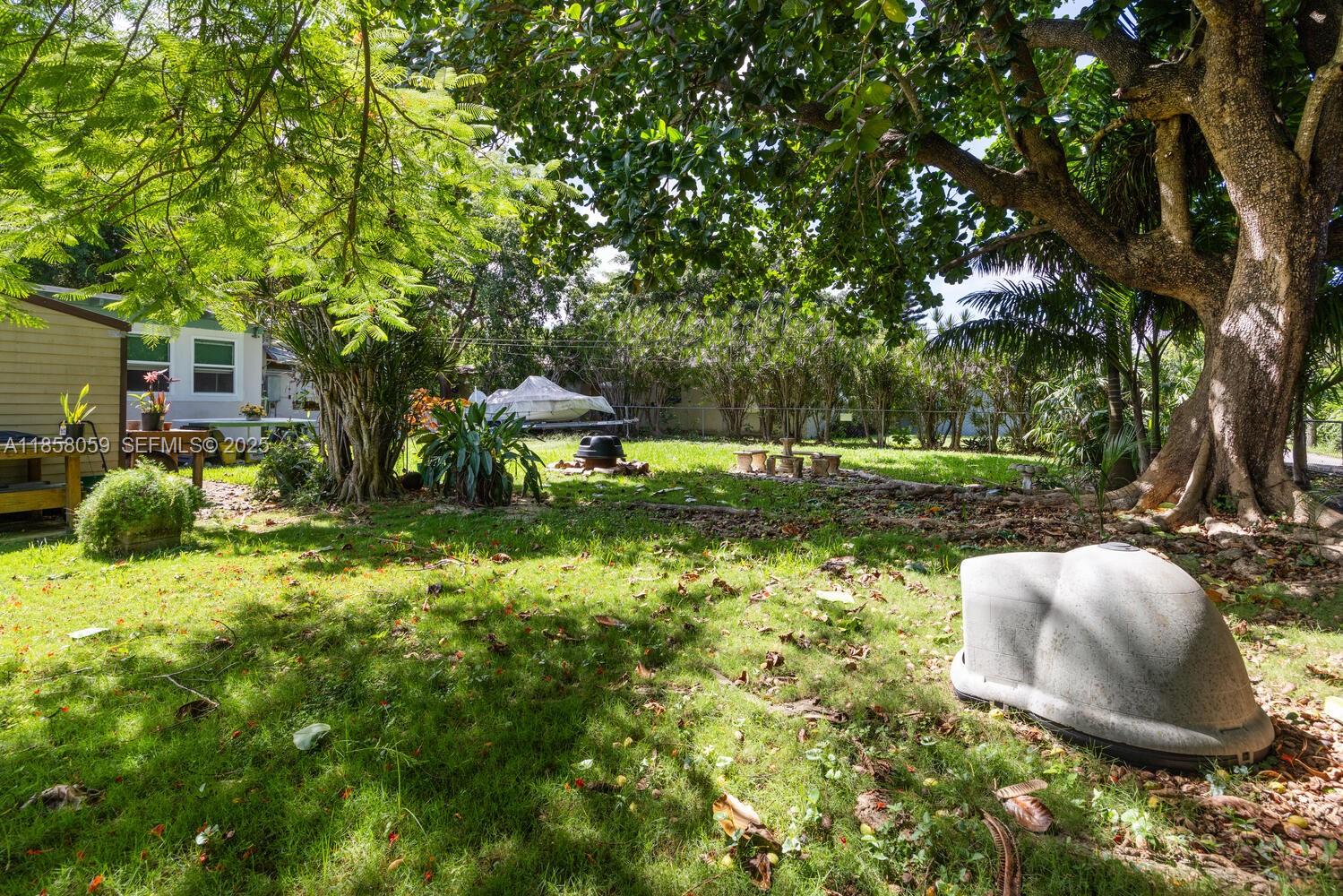 846 Northwest 3rd Avenue Homestead, FL 33030 - Photo 7 of 13 a garden view with a sitting space